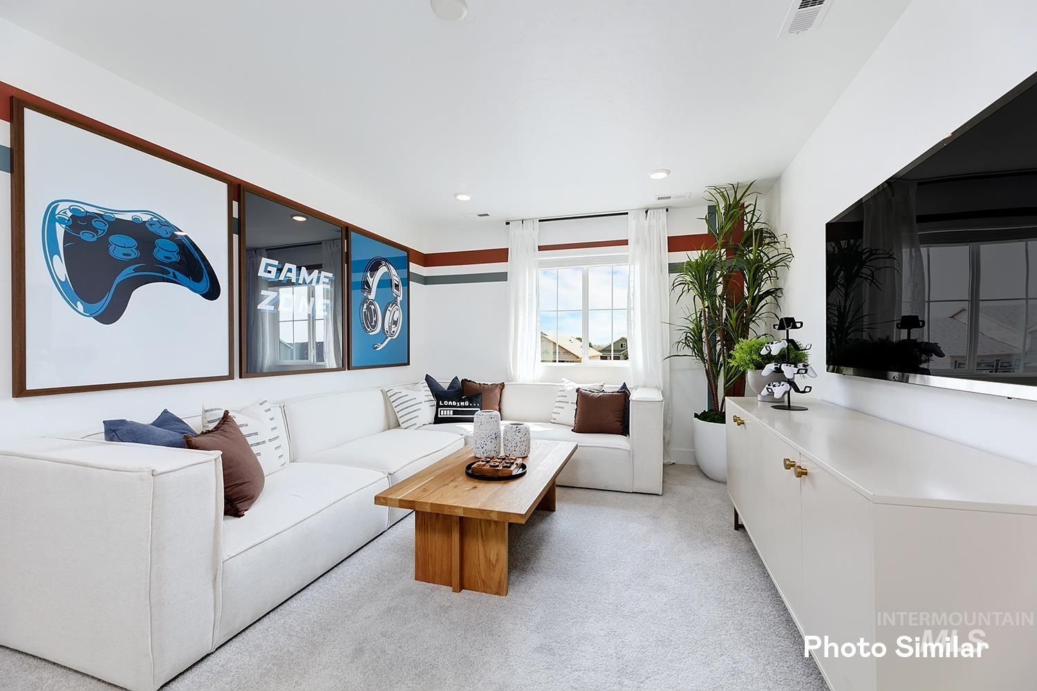 9331 West Inspirado Street Meridian, ID 83646 - Photo 23 of 34 Living room featuring light carpet and recessed lighting