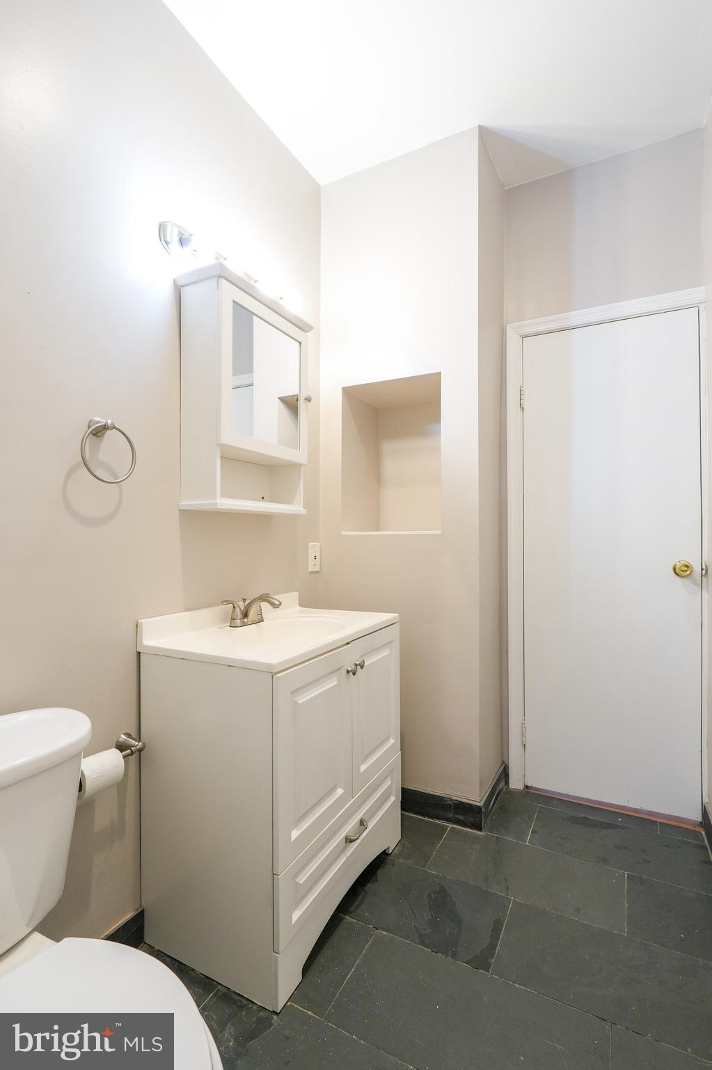 1601 Jackson Street, Unit 1 Philadelphia, PA 19145 - Photo 13 of 16 a bathroom with a sink toilet and shower