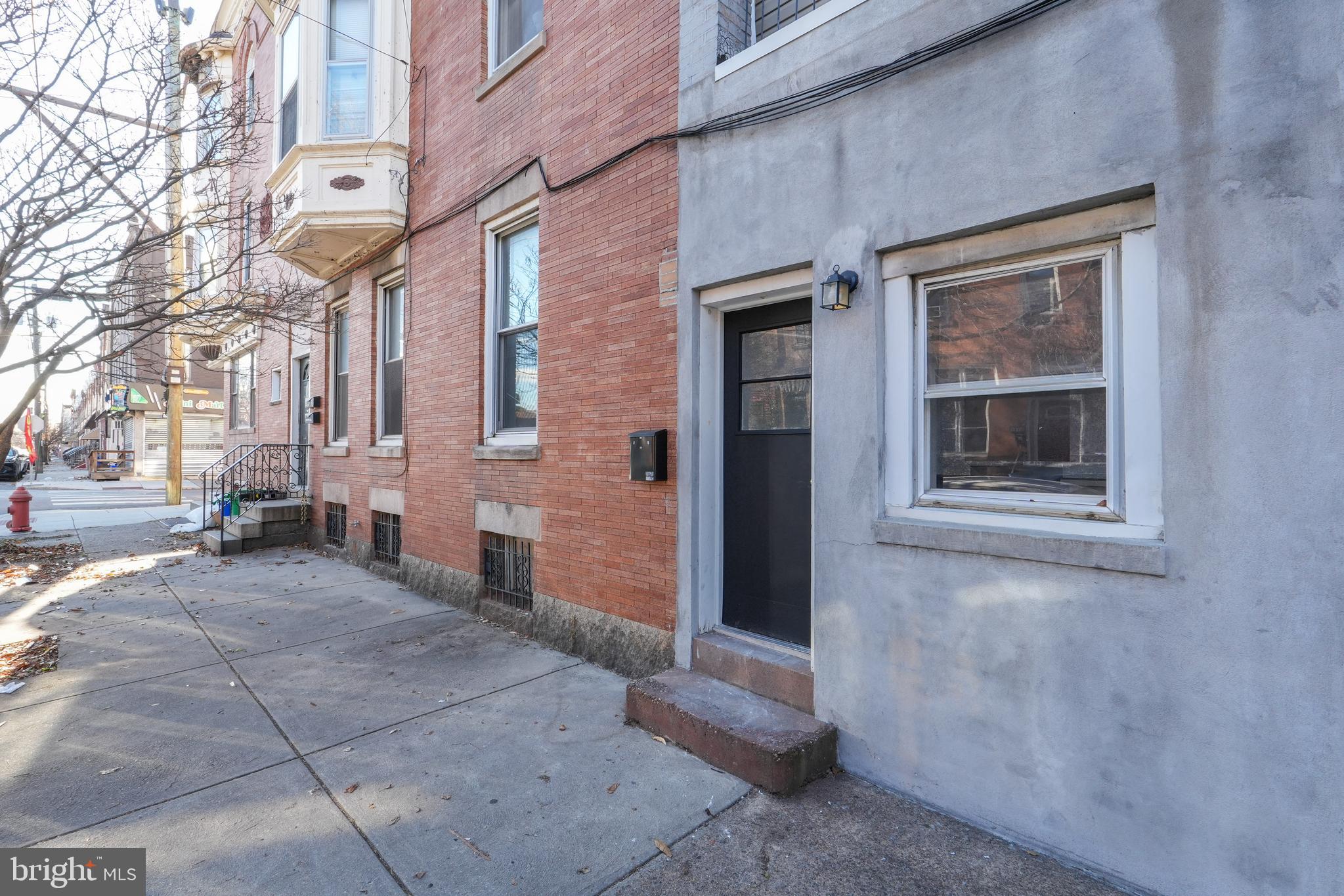 1601 Jackson Street, Unit 1 Philadelphia, PA 19145 - Photo 2 of 16 a view of a brick building with many windows