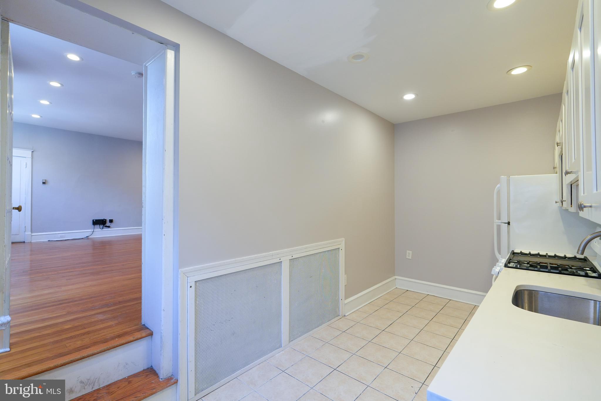 1601 Jackson Street, Unit 1 Philadelphia, PA 19145 - Photo 4 of 16 a kitchen with a sink and cabinets