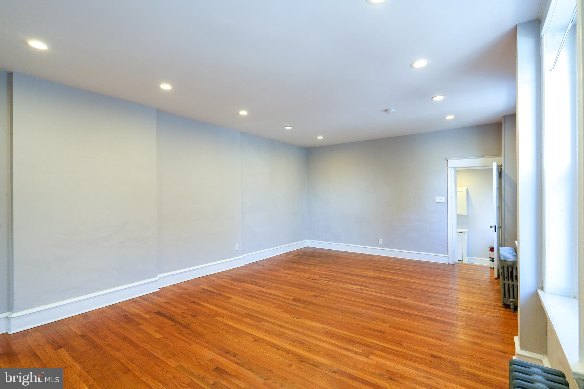 1601 Jackson Street, Unit 1 Philadelphia, PA 19145 - Photo 8 of 16 a view of empty room with wooden floor