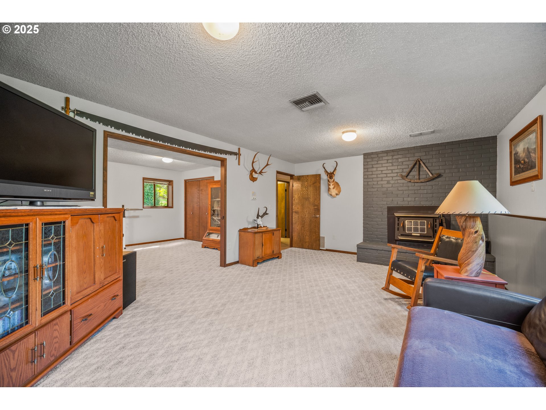 9420 Southeast Carnaby Way Happy Valley, OR 97086 - Photo 23 of 43 a living room with furniture and a flat screen tv