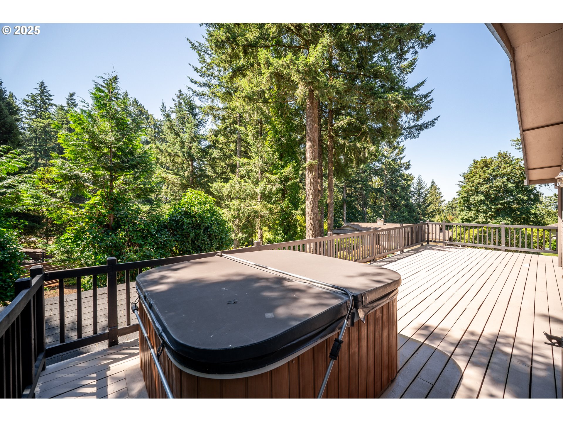9420 Southeast Carnaby Way Happy Valley, OR 97086 - Photo 29 of 43 a view of balcony with wooden floor and outdoor seating
