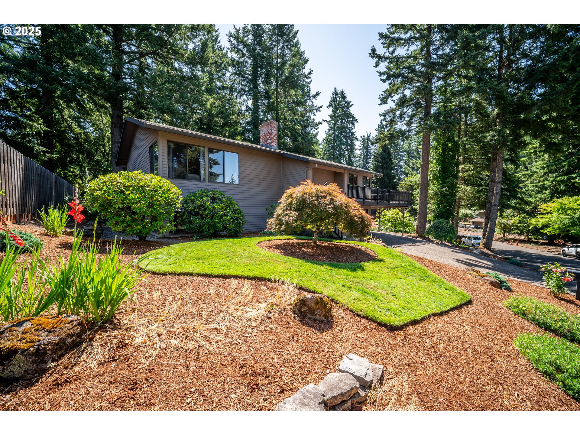 9420 Southeast Carnaby Way Happy Valley, OR 97086 - Photo 37 of 43 a view of a backyard with a garden