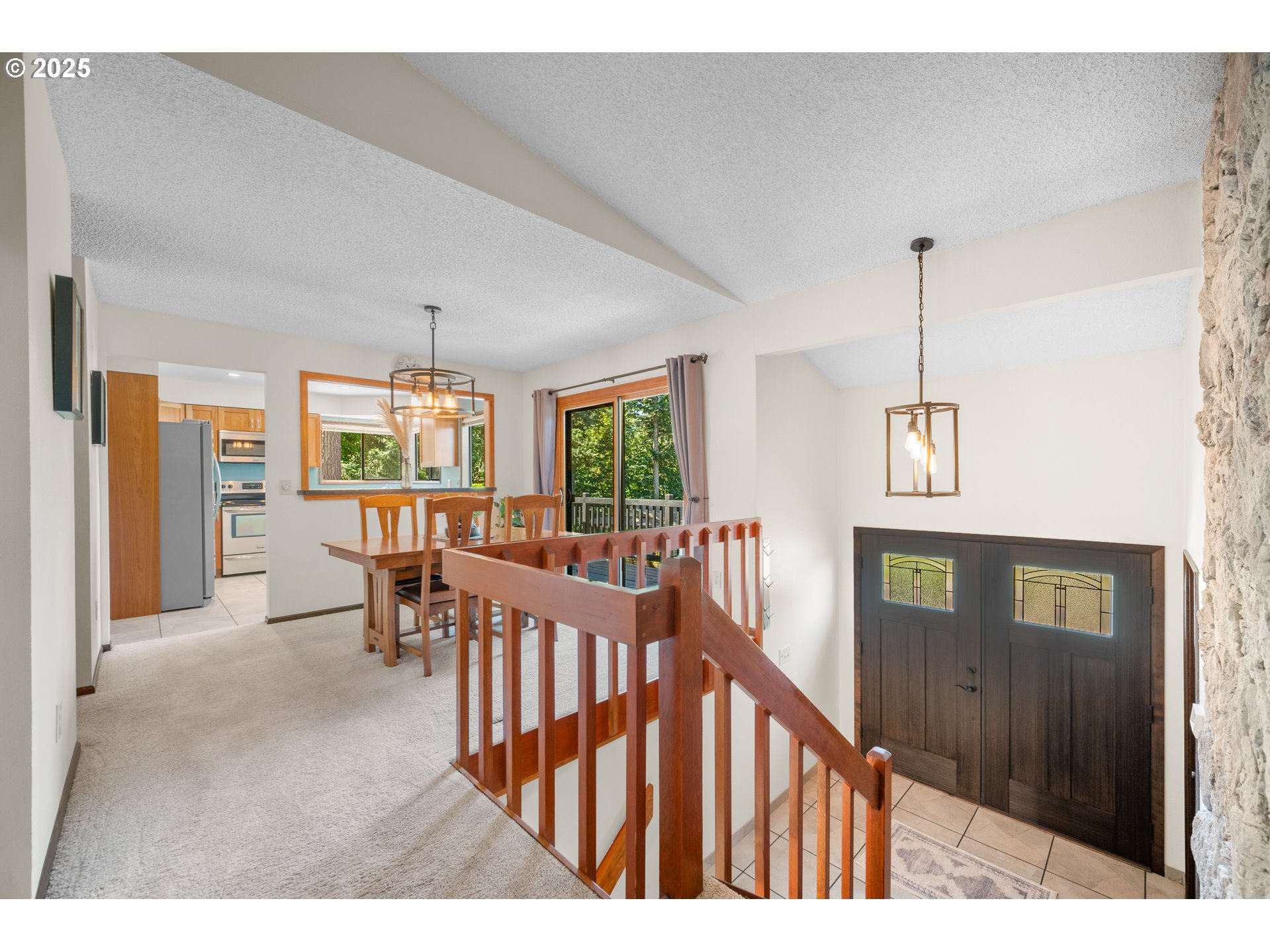 9420 Southeast Carnaby Way Happy Valley, OR 97086 - Photo 5 of 43 a view of a hallway with furniture and windows