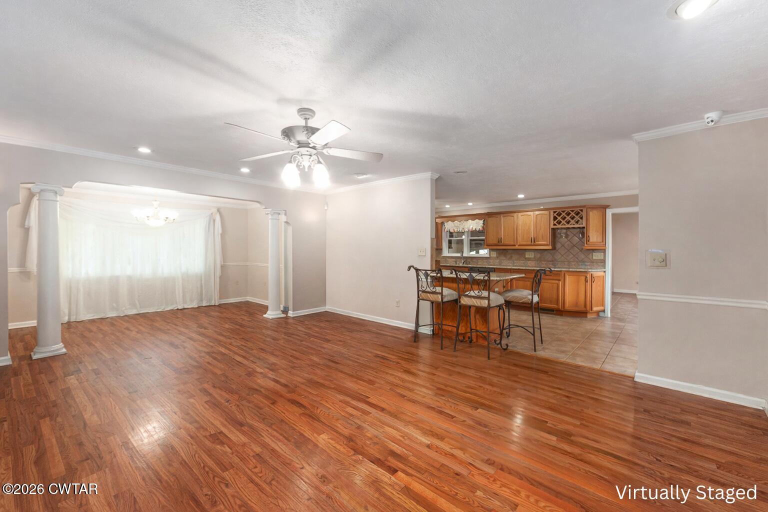 812 Pipkin Road Jackson, TN 38305 - Photo 14 of 62 a view of a livingroom with furniture a ceiling fan and wooden floor