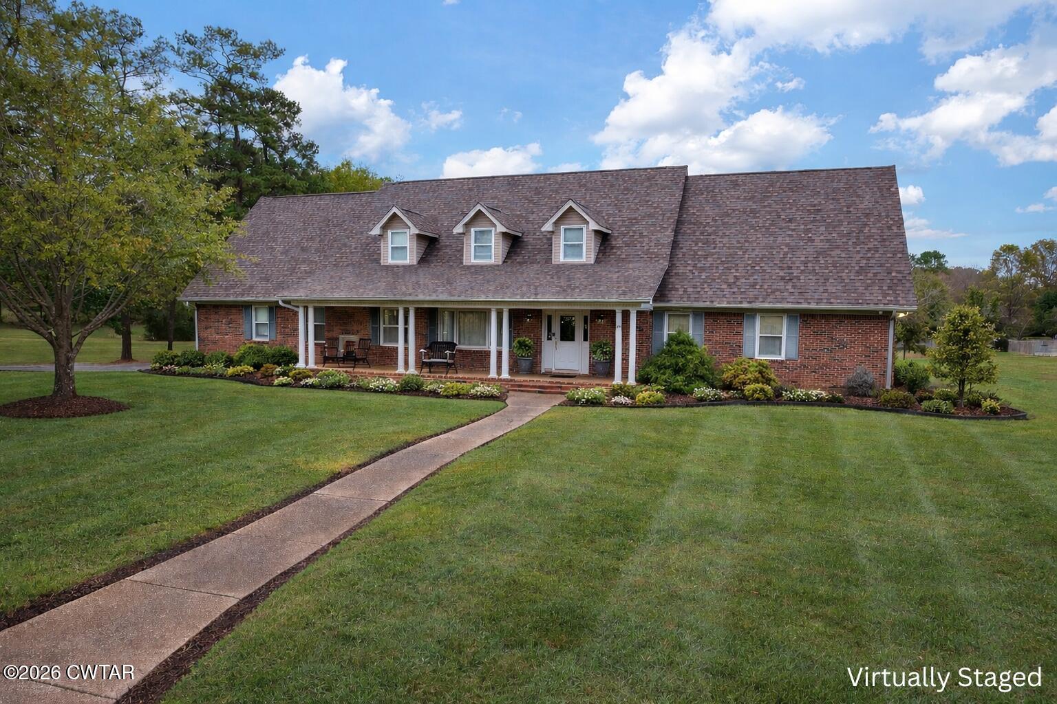 812 Pipkin Road Jackson, TN 38305 - Photo 2 of 62 a front view of a house with a yard