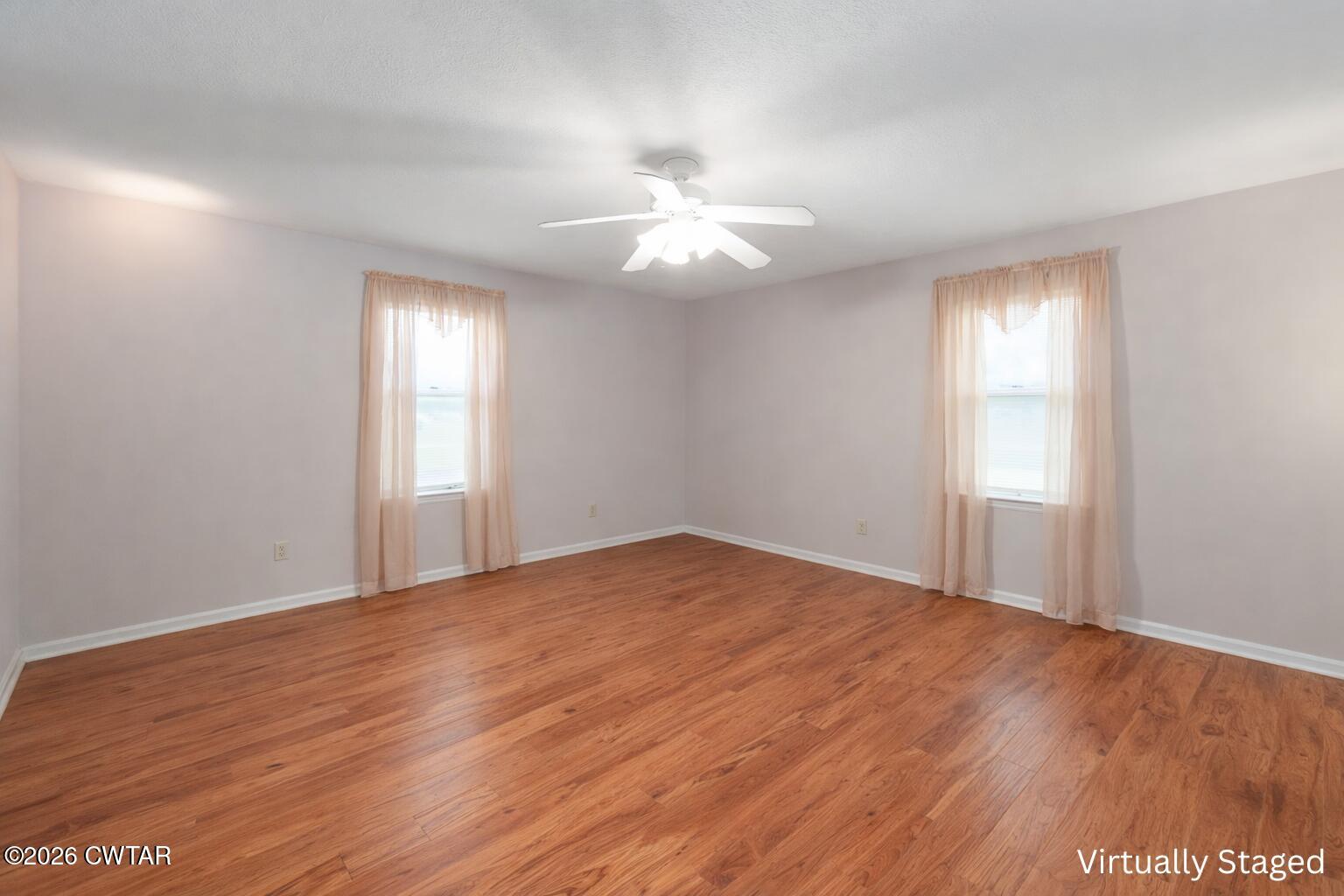 812 Pipkin Road Jackson, TN 38305 - Photo 28 of 62 a view of an empty room with window and wooden floor