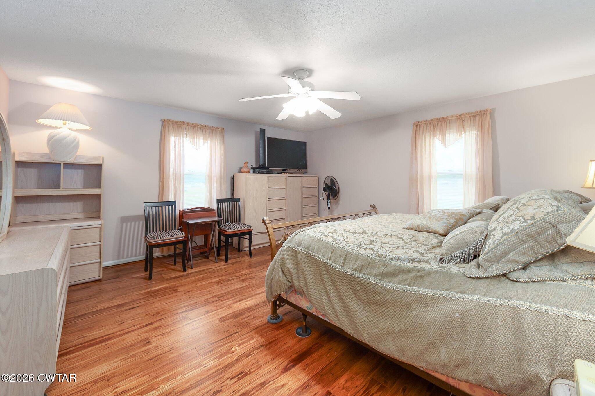 812 Pipkin Road Jackson, TN 38305 - Photo 29 of 62 a bedroom with a bed and a chandelier