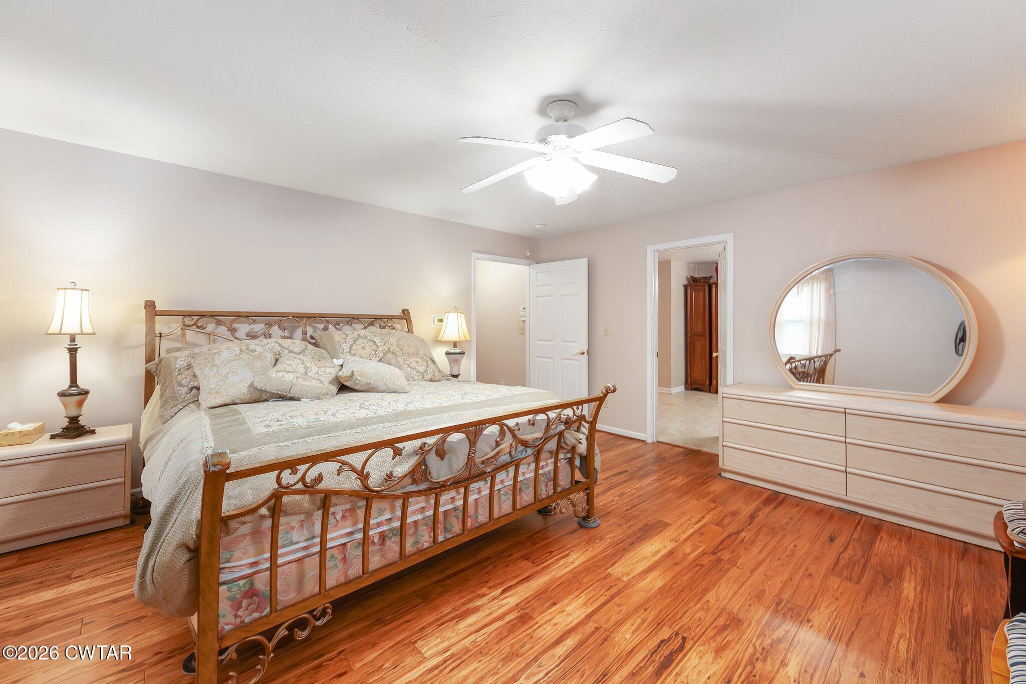 812 Pipkin Road Jackson, TN 38305 - Photo 31 of 62 a spacious bedroom with a bed and a dresser