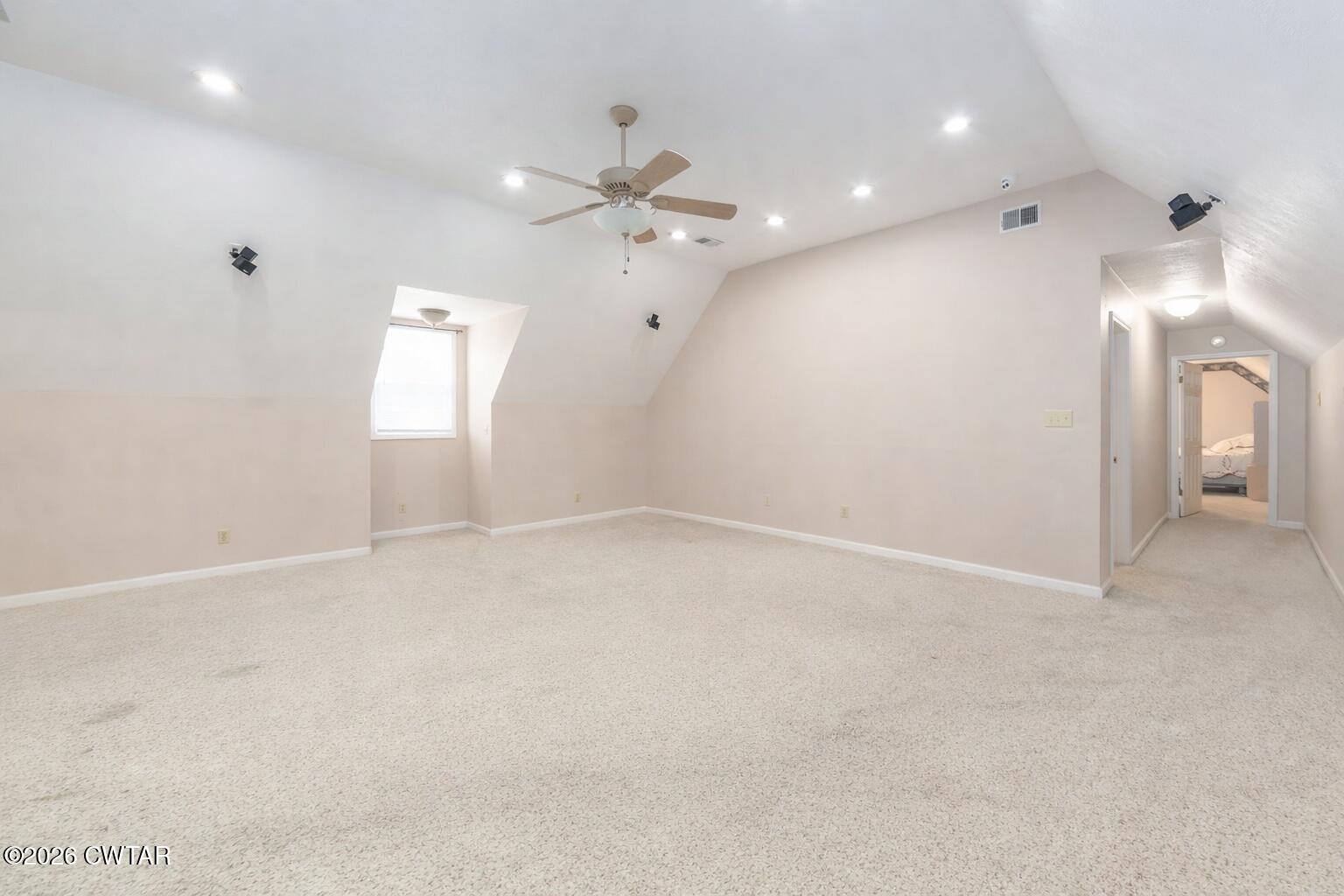 812 Pipkin Road Jackson, TN 38305 - Photo 37 of 62 an empty room with chandelier fan and windows