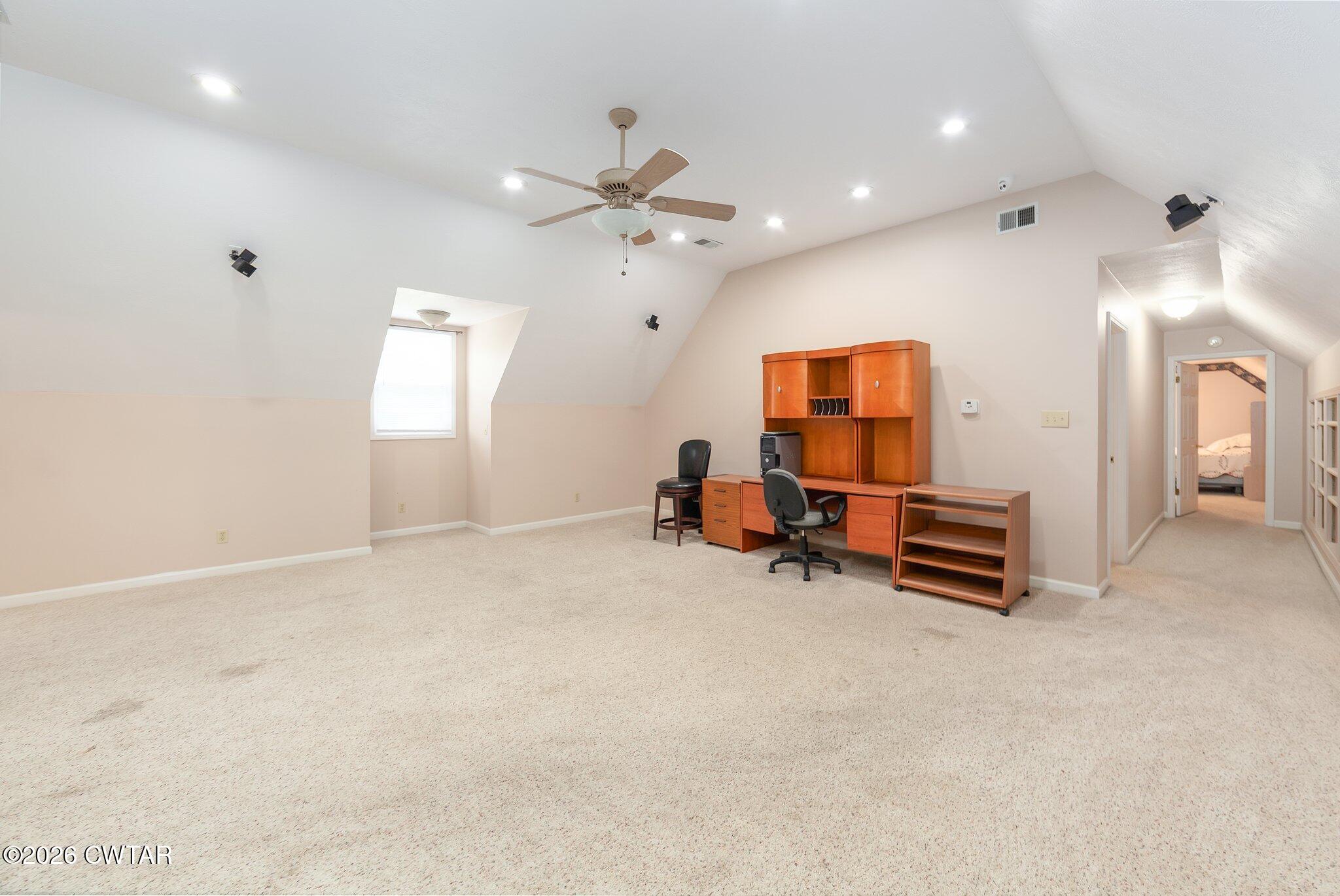 812 Pipkin Road Jackson, TN 38305 - Photo 38 of 62 an empty room with windows and ceiling fan