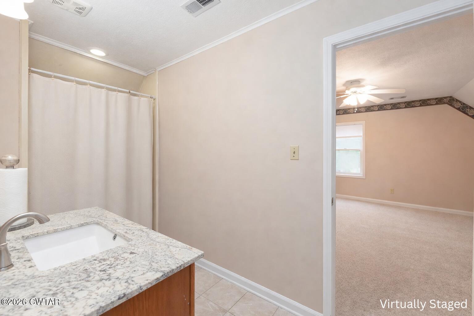 812 Pipkin Road Jackson, TN 38305 - Photo 42 of 62 a bathroom with a granite countertop sink and vanity