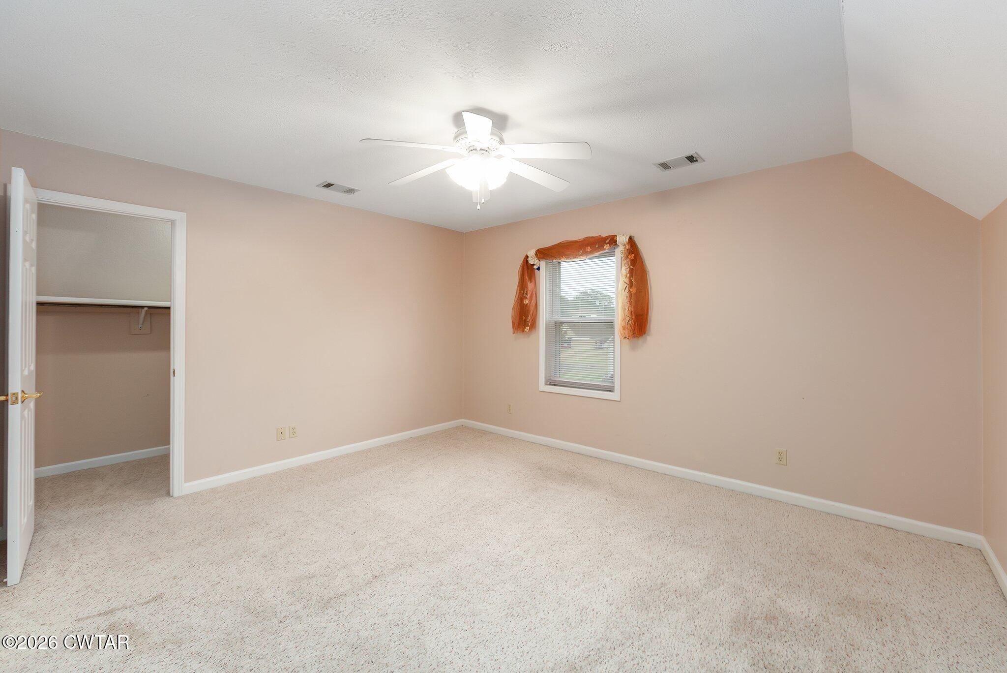 812 Pipkin Road Jackson, TN 38305 - Photo 48 of 62 an empty room with windows and fan