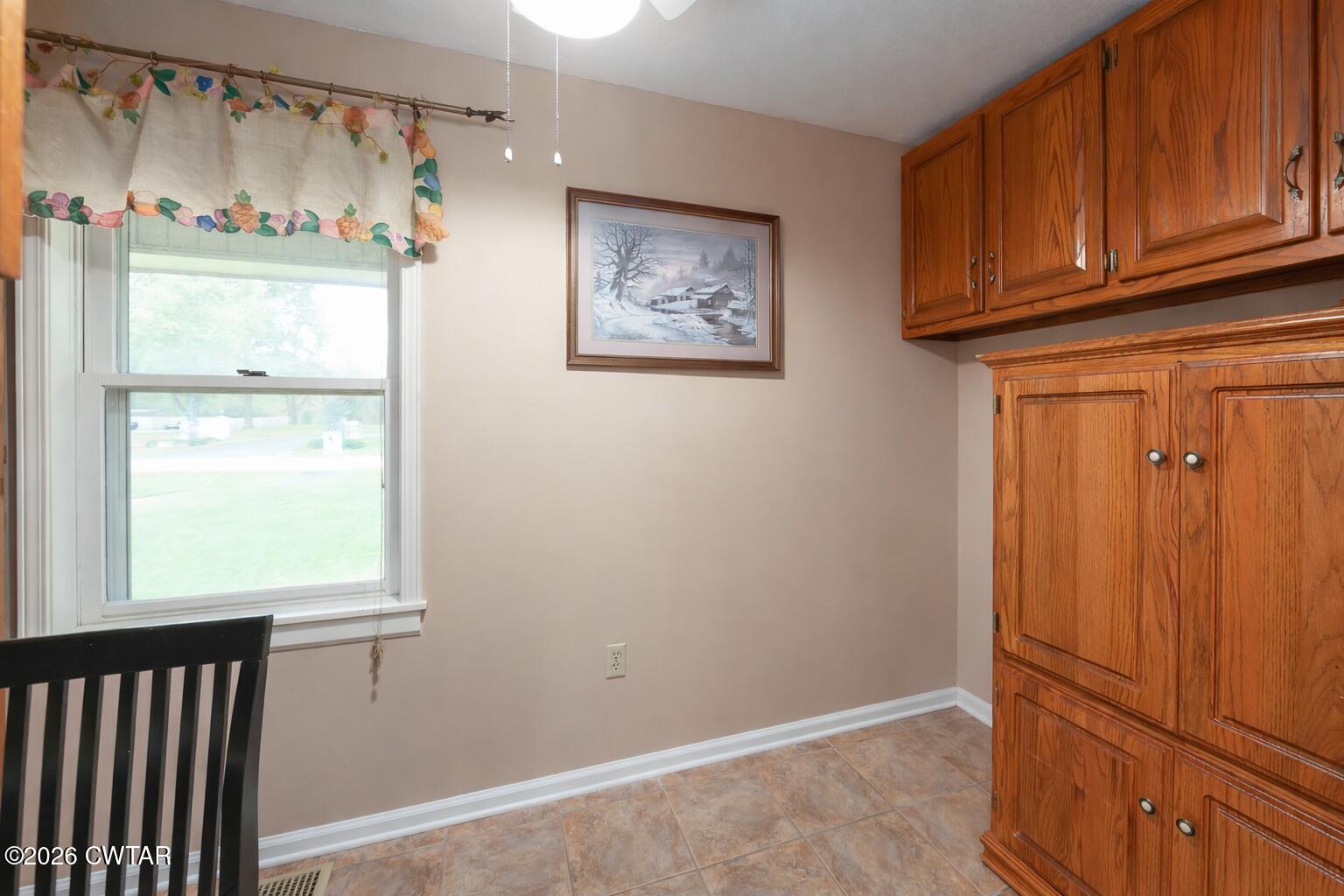 812 Pipkin Road Jackson, TN 38305 - Photo 53 of 62 a view of an empty room with wooden floor and a window