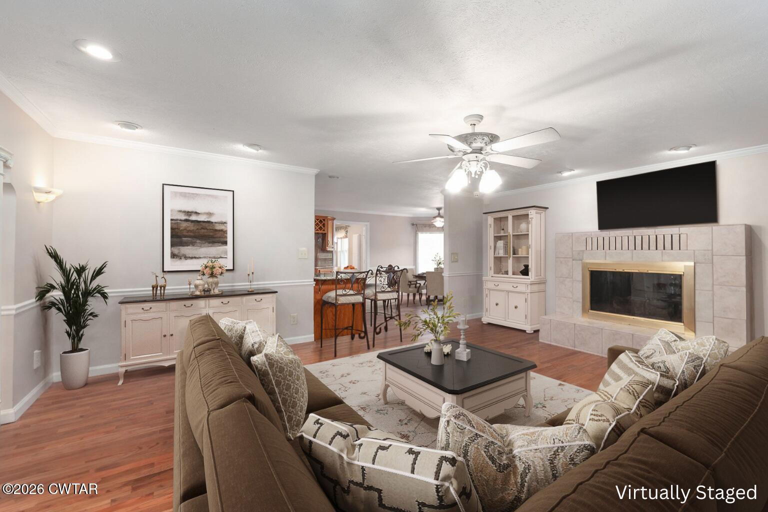 812 Pipkin Road Jackson, TN 38305 - Photo 7 of 62 a living room with furniture a fireplace and a flat screen tv