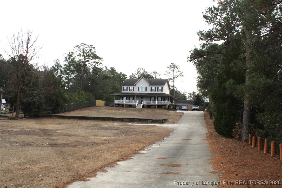 573 Porter Road Hope Mills, NC 28348 - Photo 28 of 29 a view of house with outdoor space and sitting area