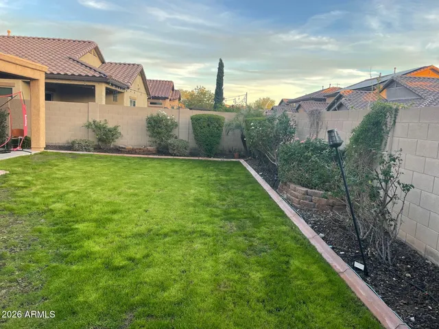 a view of a back yard of the house