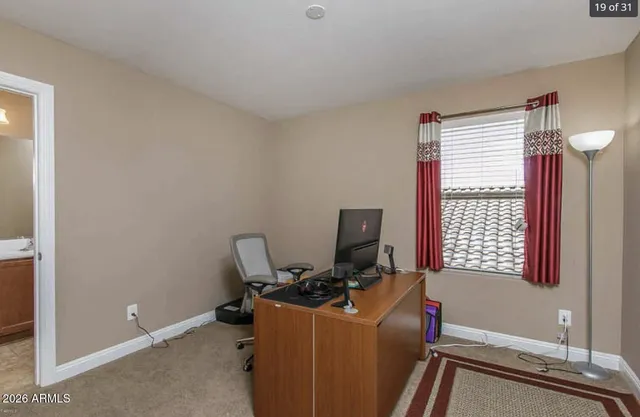 a view of workspace with wooden floor windows