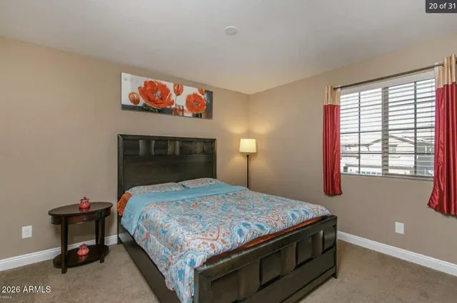 a bedroom with a bed and a table