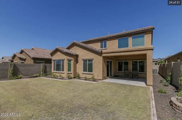 a front view of a house with yard