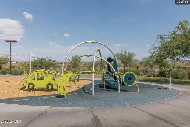 a childrens park with lots of swings and slides