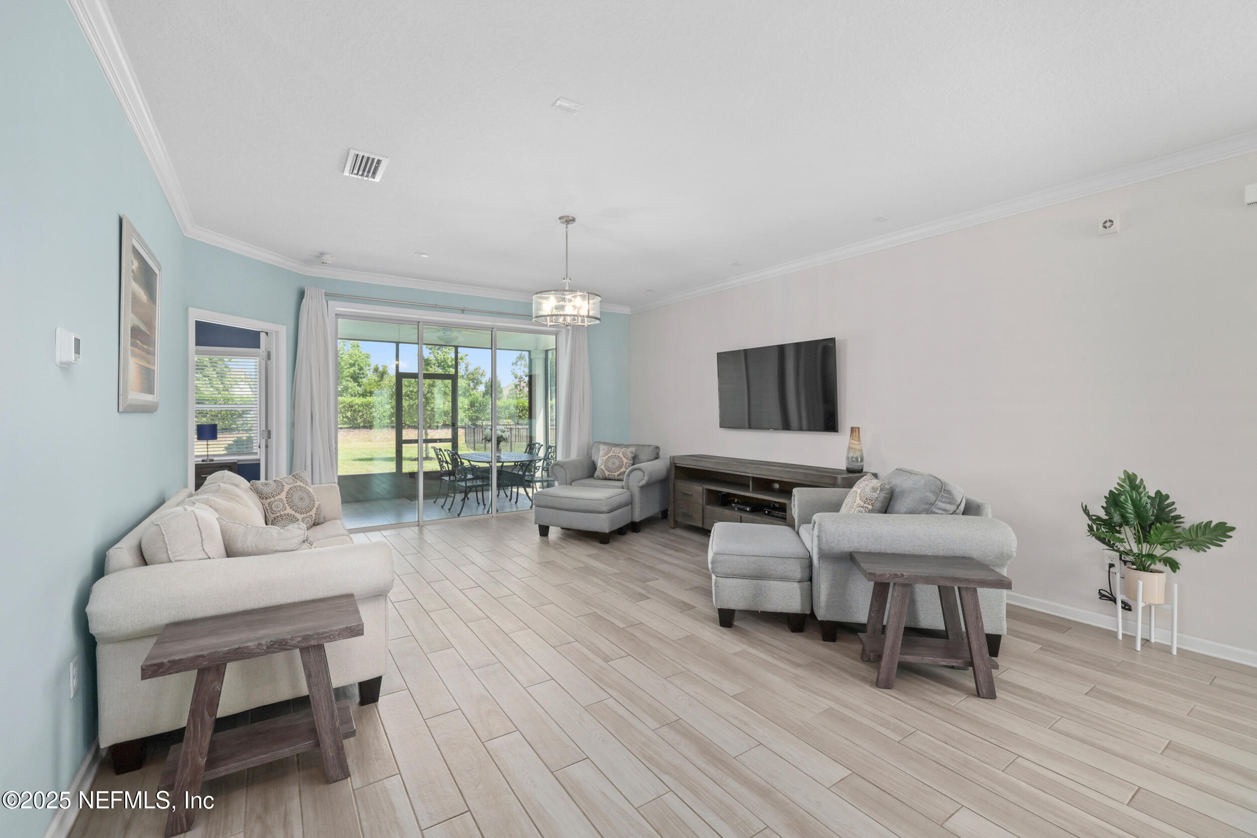 58 Strobe Court St. Augustine, FL 32095 - Photo 13 of 50 a living room with furniture and a flat screen tv