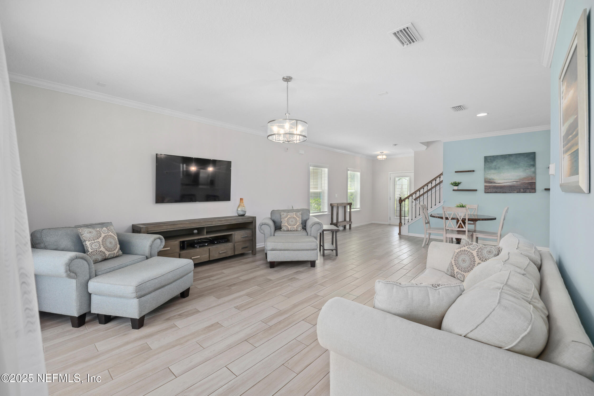 58 Strobe Court St. Augustine, FL 32095 - Photo 14 of 50 a living room with furniture and a flat screen tv