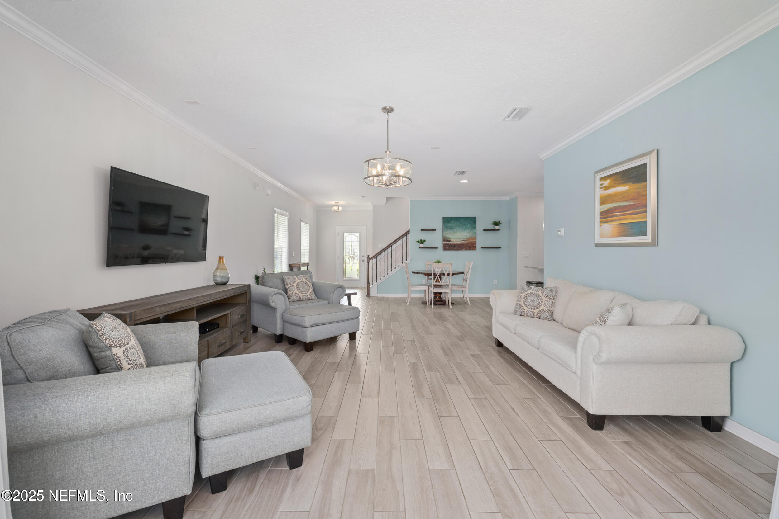 58 Strobe Court St. Augustine, FL 32095 - Photo 15 of 50 a living room with furniture and a chandelier