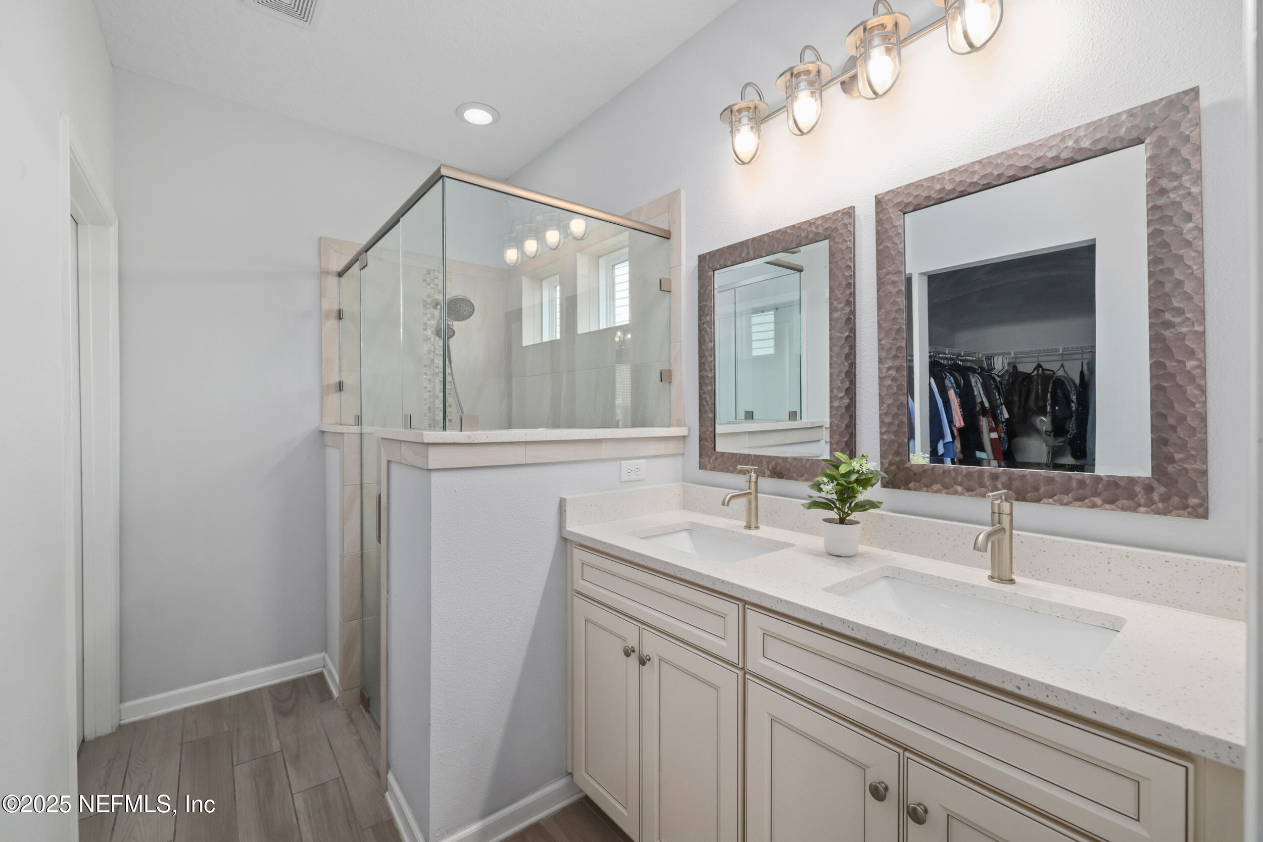 58 Strobe Court St. Augustine, FL 32095 - Photo 18 of 50 a bathroom with a sink a mirror and a shower