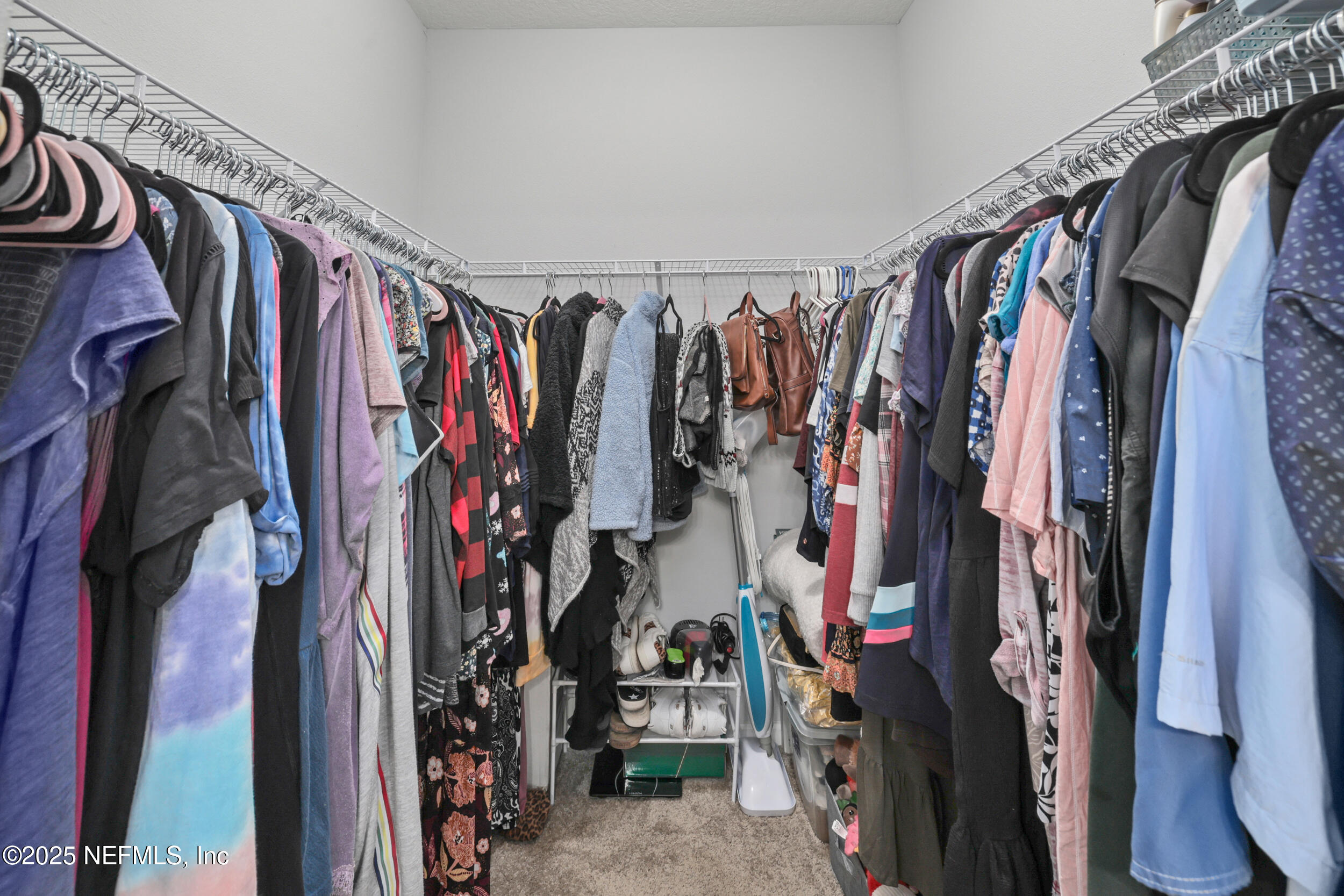 58 Strobe Court St. Augustine, FL 32095 - Photo 20 of 50 a view of walk in closet with clothes