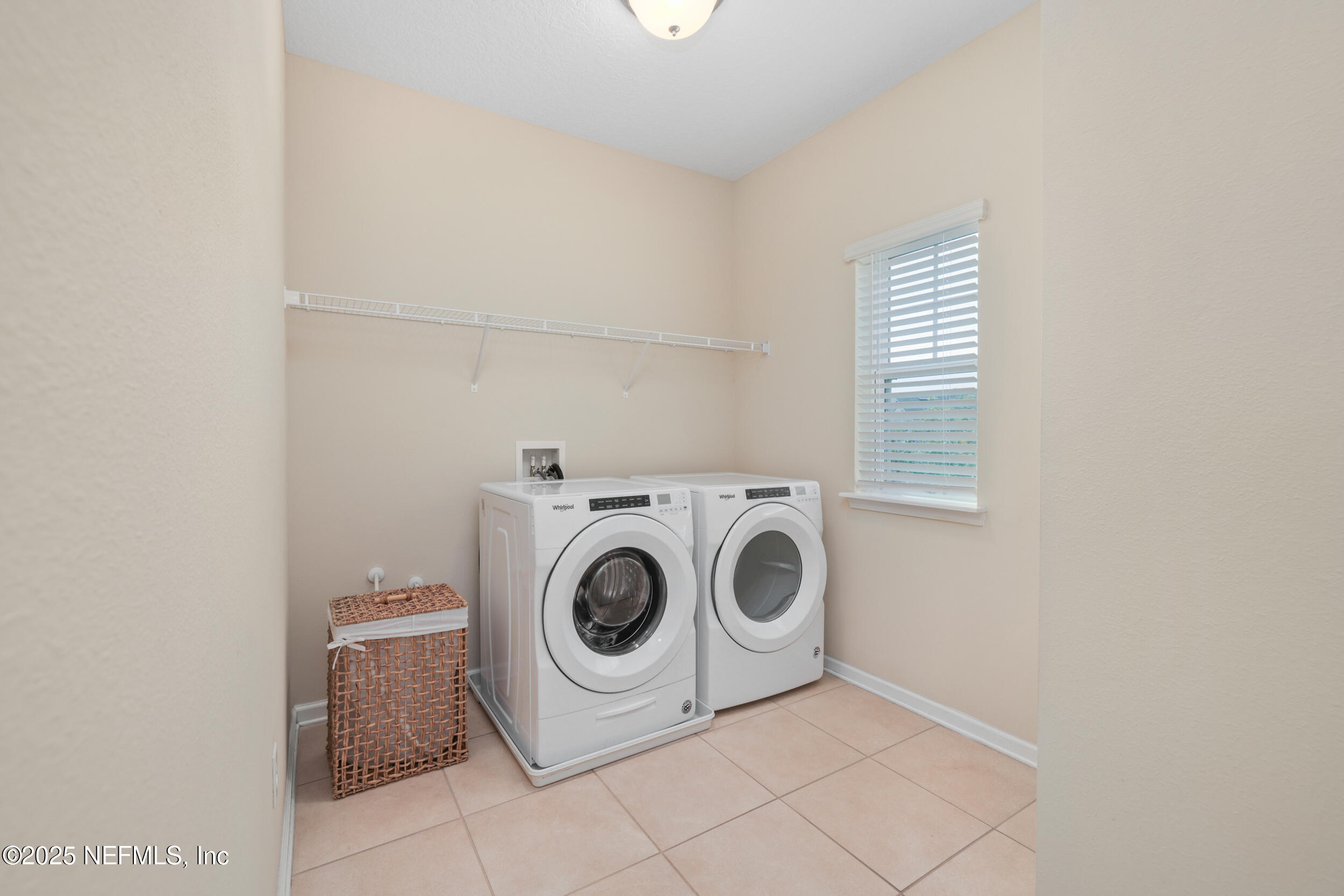 58 Strobe Court St. Augustine, FL 32095 - Photo 26 of 50 a utility room with dryer and washer