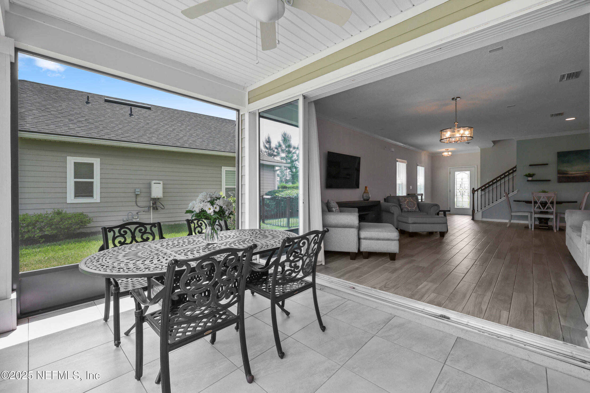 58 Strobe Court St. Augustine, FL 32095 - Photo 27 of 50 a view of a patio with table and chairs