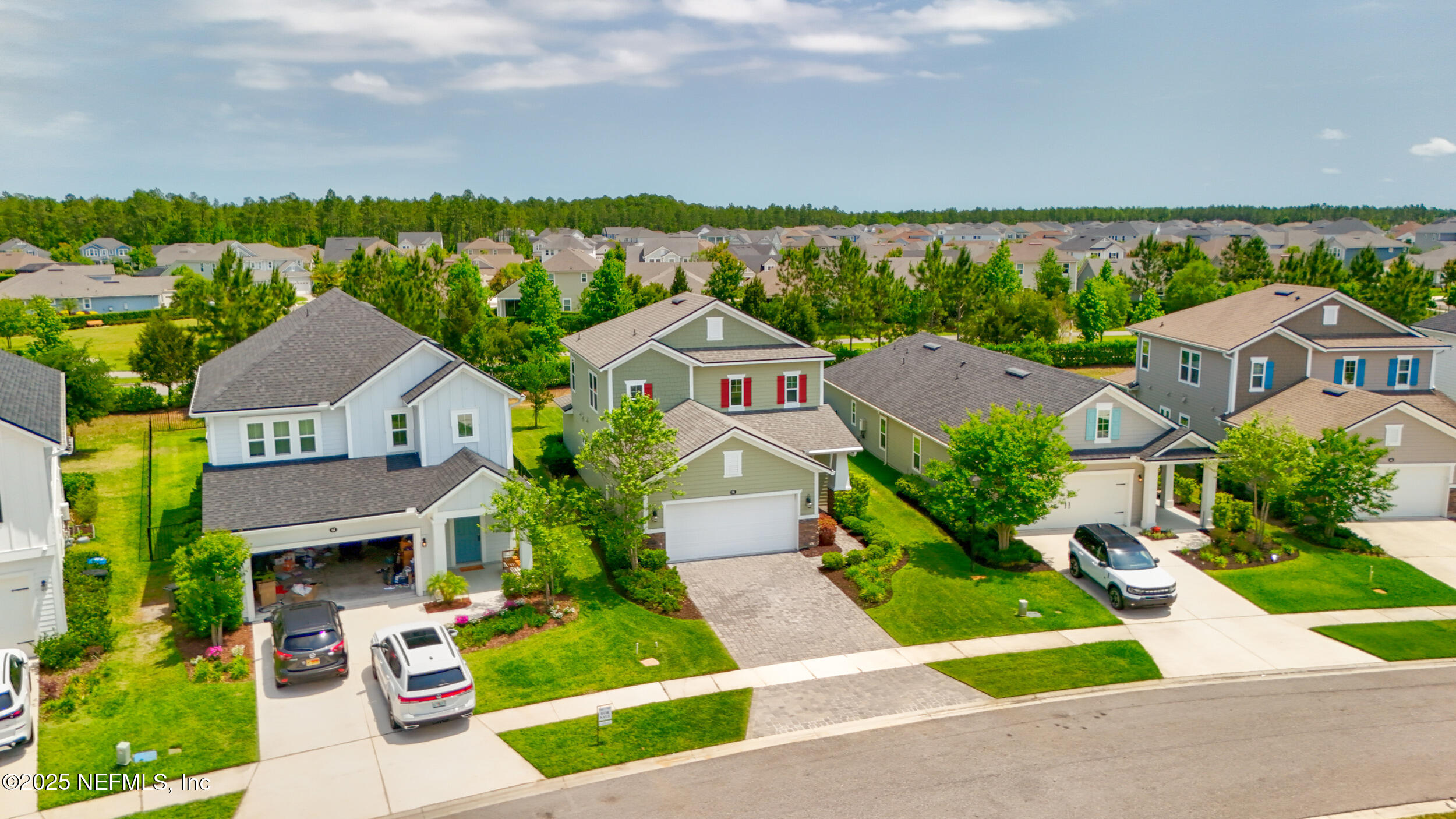 58 Strobe Court St. Augustine, FL 32095 - Photo 34 of 50 an aerial view of multiple houses with a yard