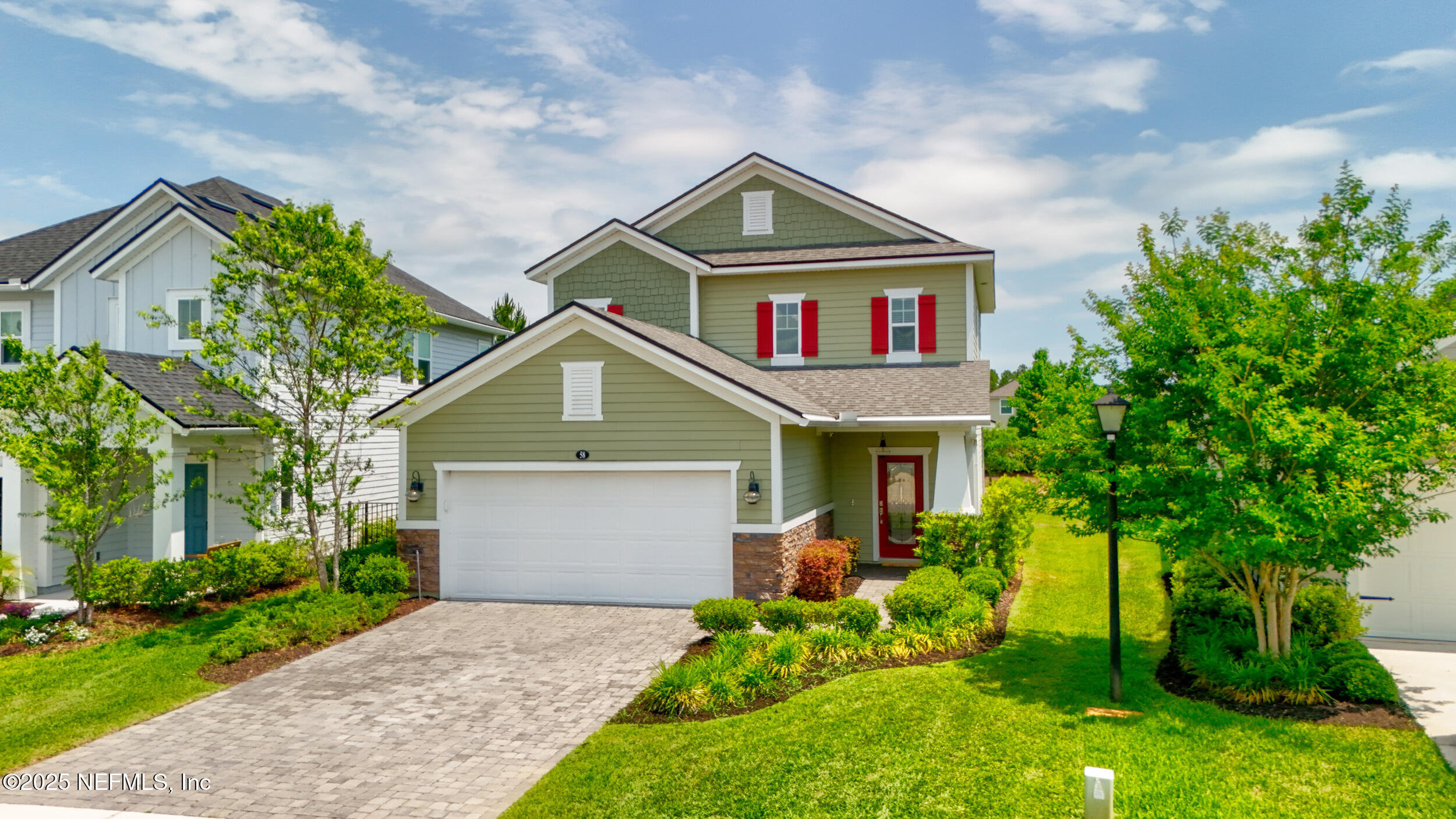 58 Strobe Court St. Augustine, FL 32095 - Photo 35 of 50 a front view of a house with garden