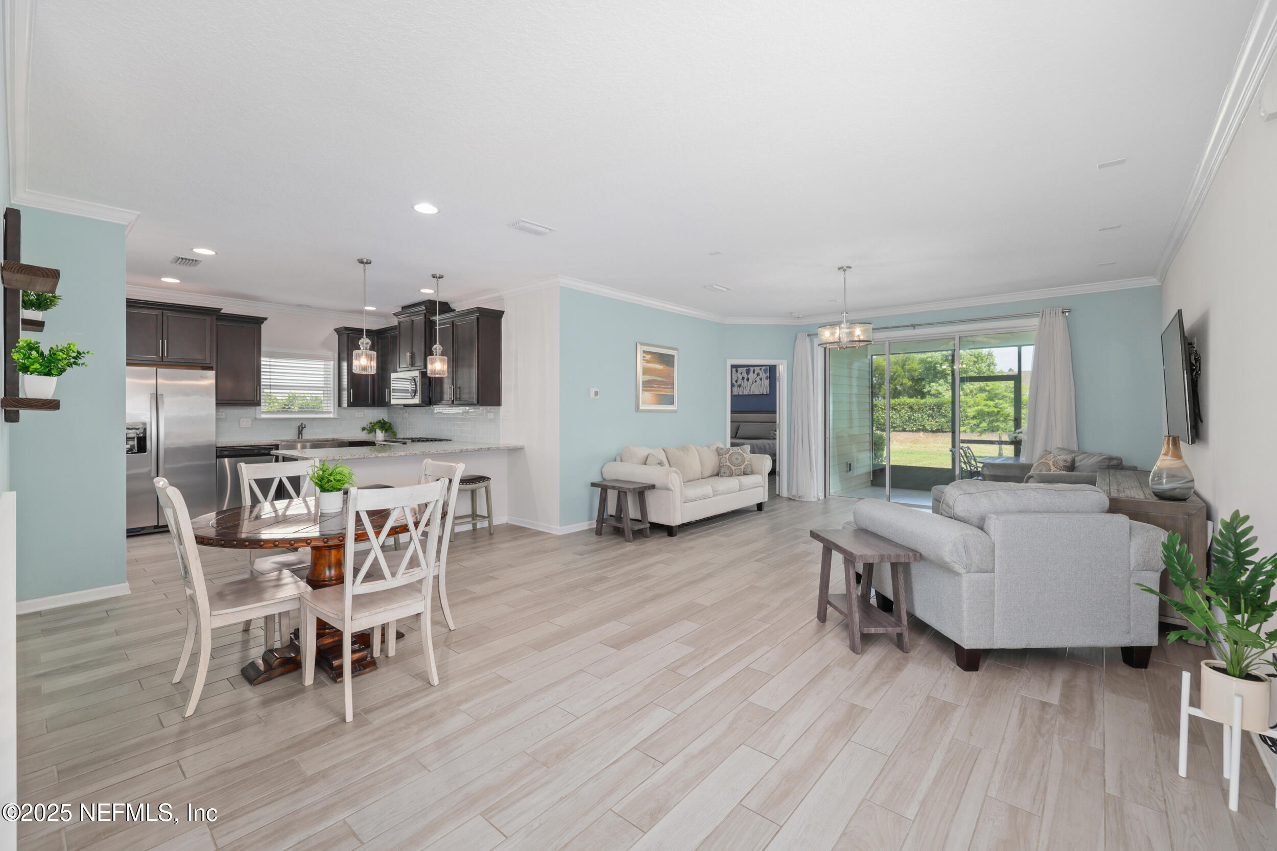 58 Strobe Court St. Augustine, FL 32095 - Photo 50 of 50 a living room with furniture and a wooden floor