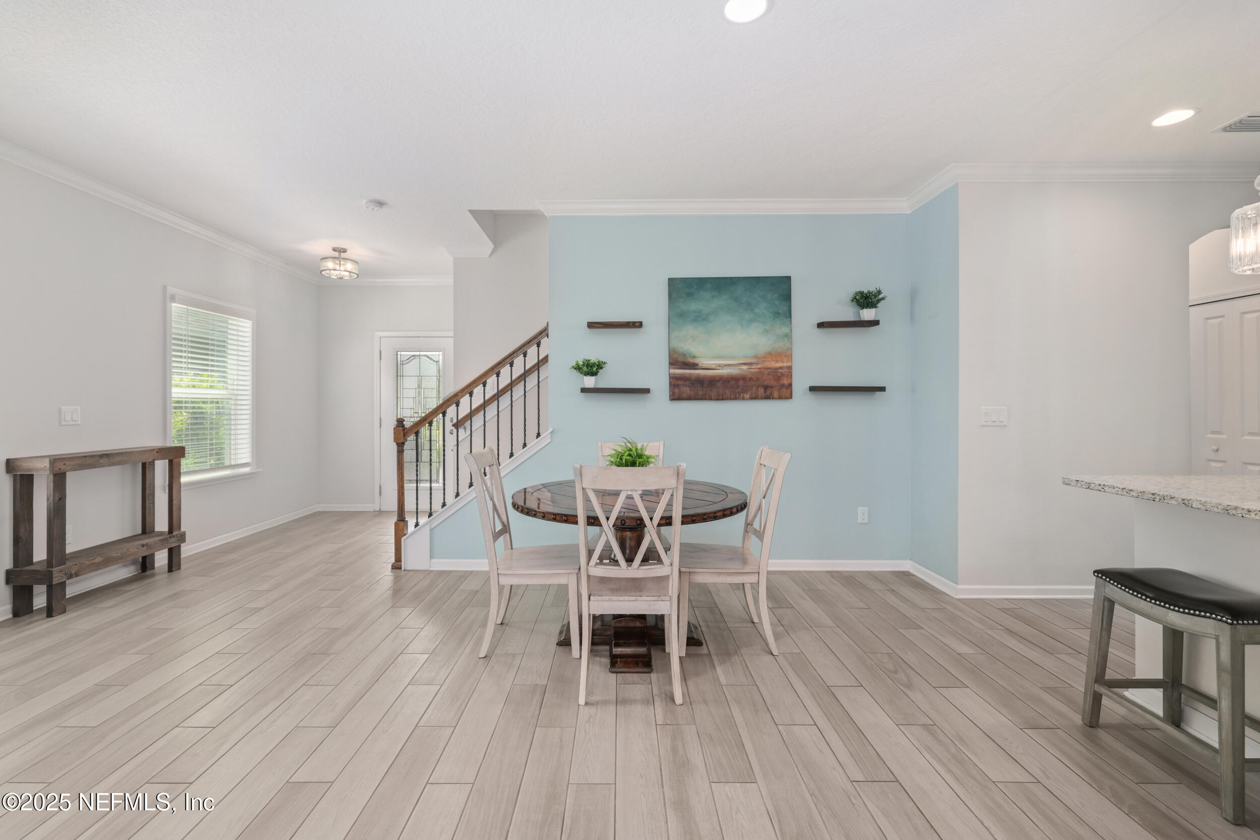 58 Strobe Court St. Augustine, FL 32095 - Photo 8 of 50 a dining room with furniture a chandelier and wooden floor