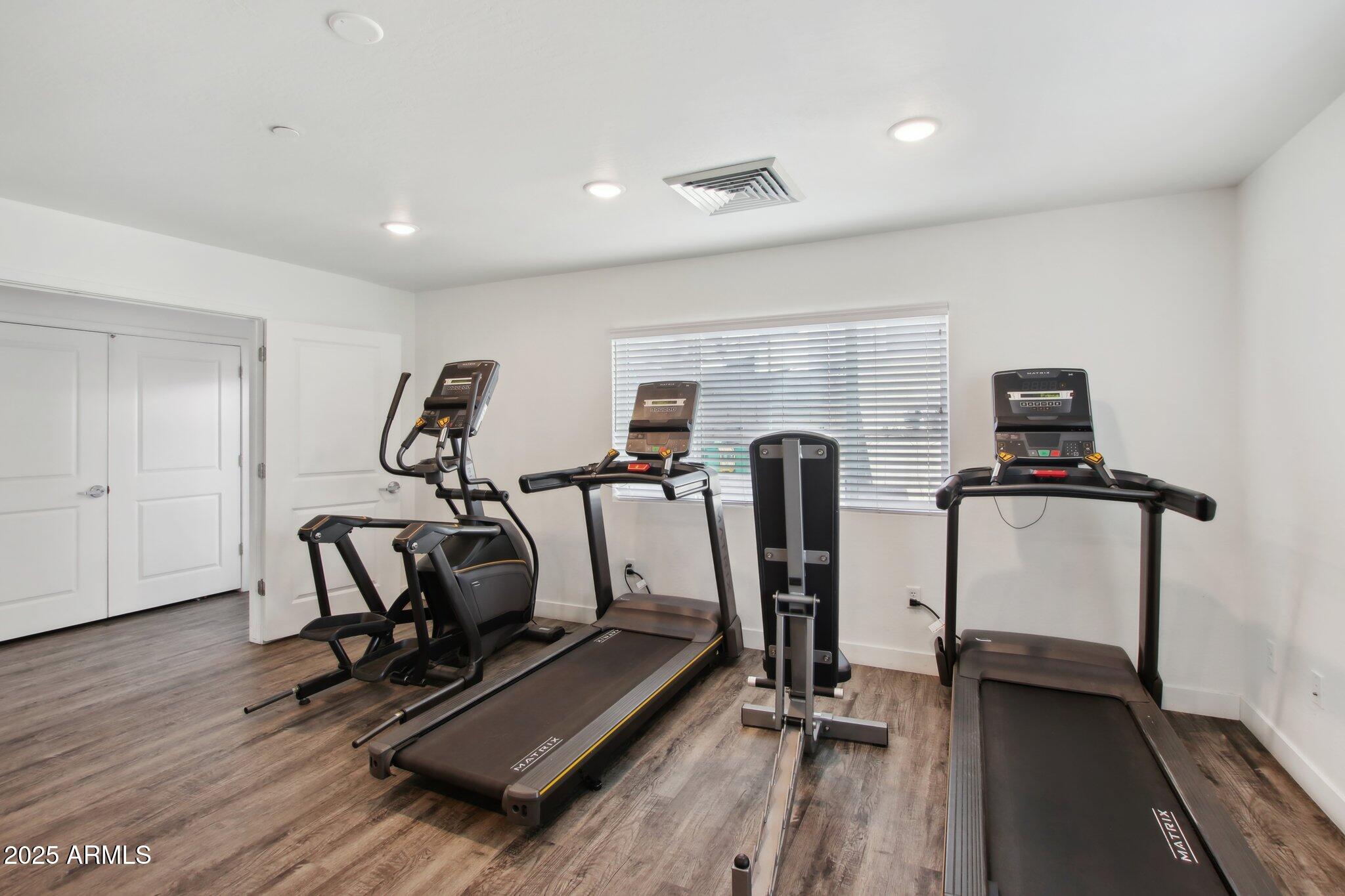 12925 West Greenway Road, Unit 5 El Mirage, AZ 85335 - Photo 18 of 30 a view of a room with gym equipment