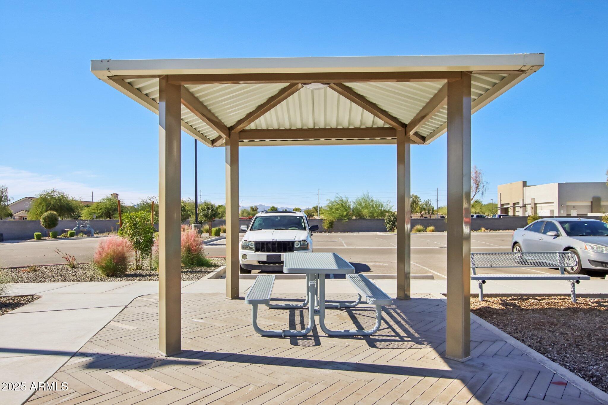 12925 West Greenway Road, Unit 5 El Mirage, AZ 85335 - Photo 26 of 30 a view of a swimming pool with a patio