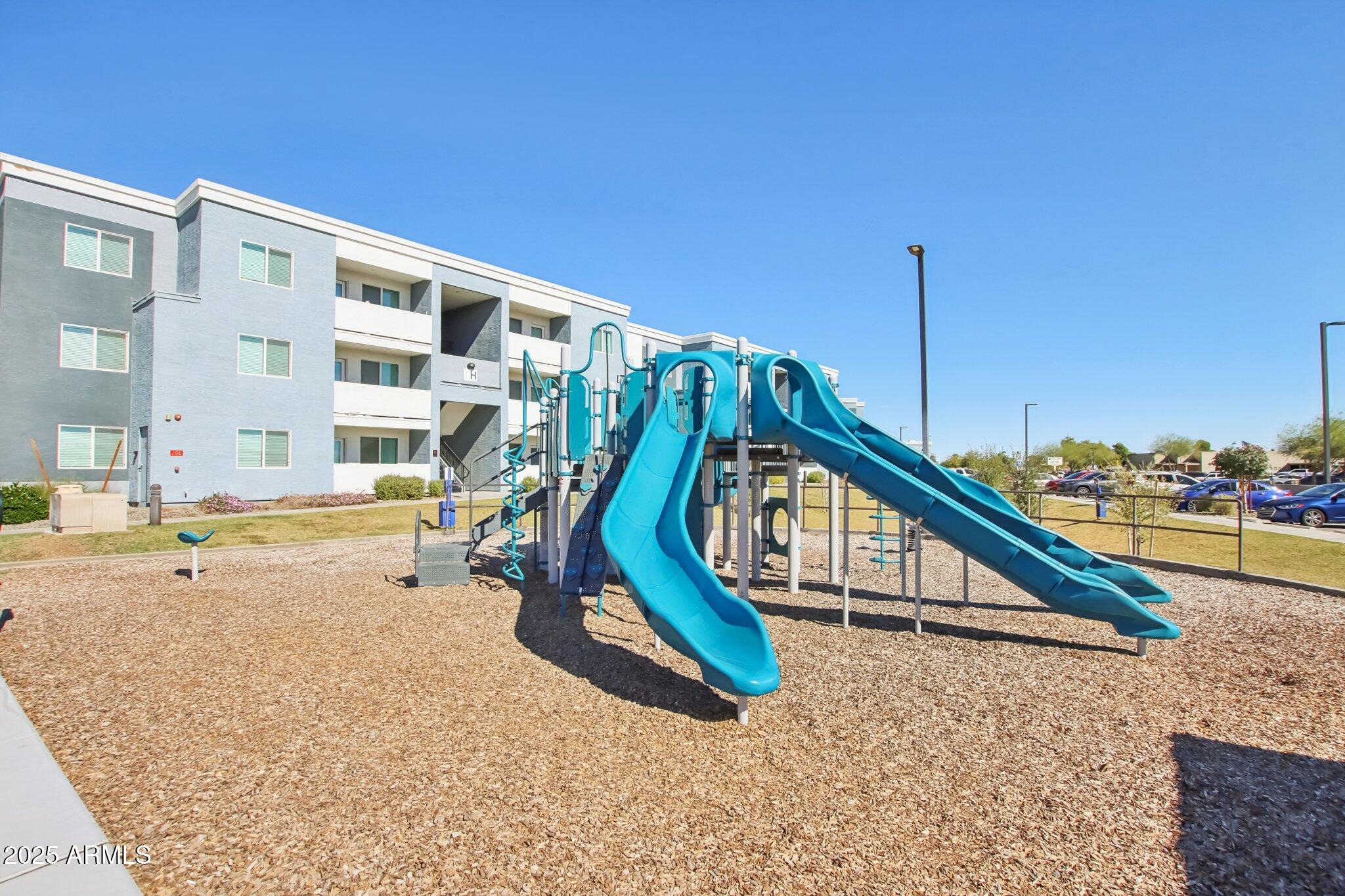 12925 West Greenway Road, Unit 5 El Mirage, AZ 85335 - Photo 27 of 30 a view of a house with a swimming pool