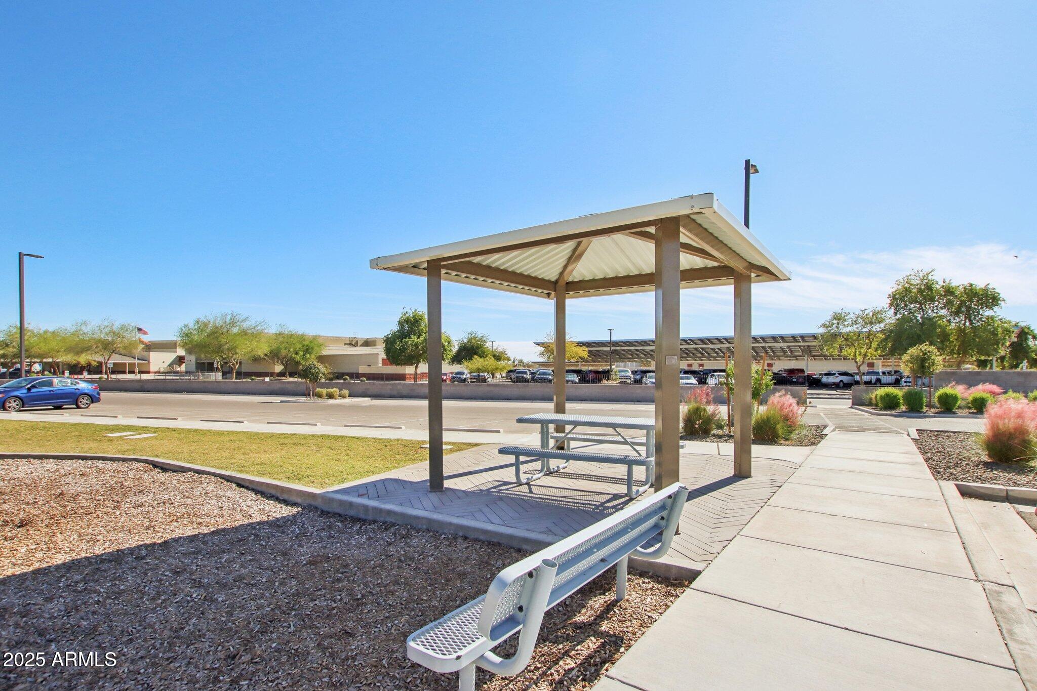 12925 West Greenway Road, Unit 5 El Mirage, AZ 85335 - Photo 28 of 30 a view of a swimming pool with a patio