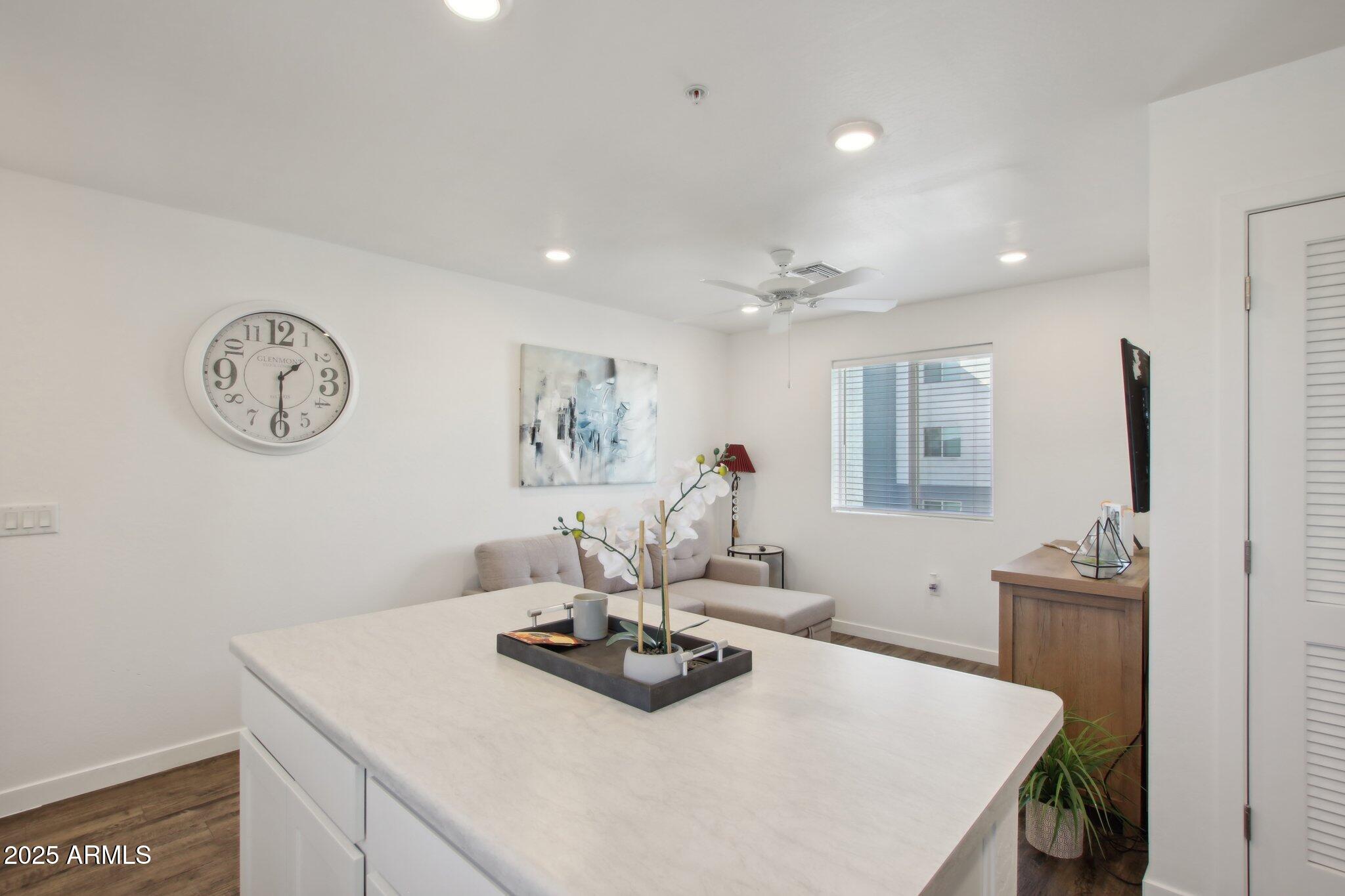 12925 West Greenway Road, Unit 5 El Mirage, AZ 85335 - Photo 9 of 30 a view of a dining room with furniture and a table