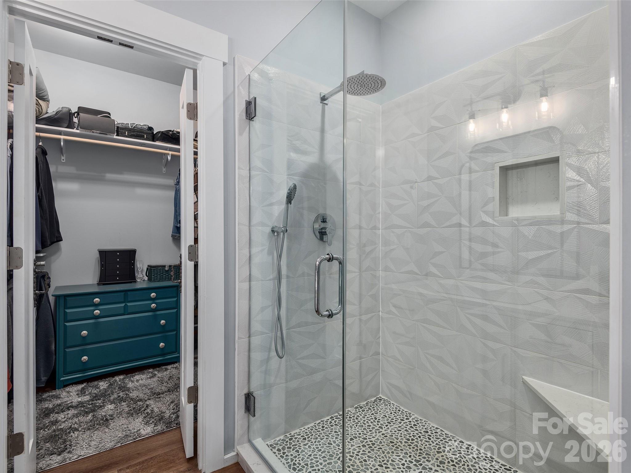 3244 Lake Adger Parkway Mill Spring, NC 28756 - Photo 24 of 44 a bathroom with a shower and a sink