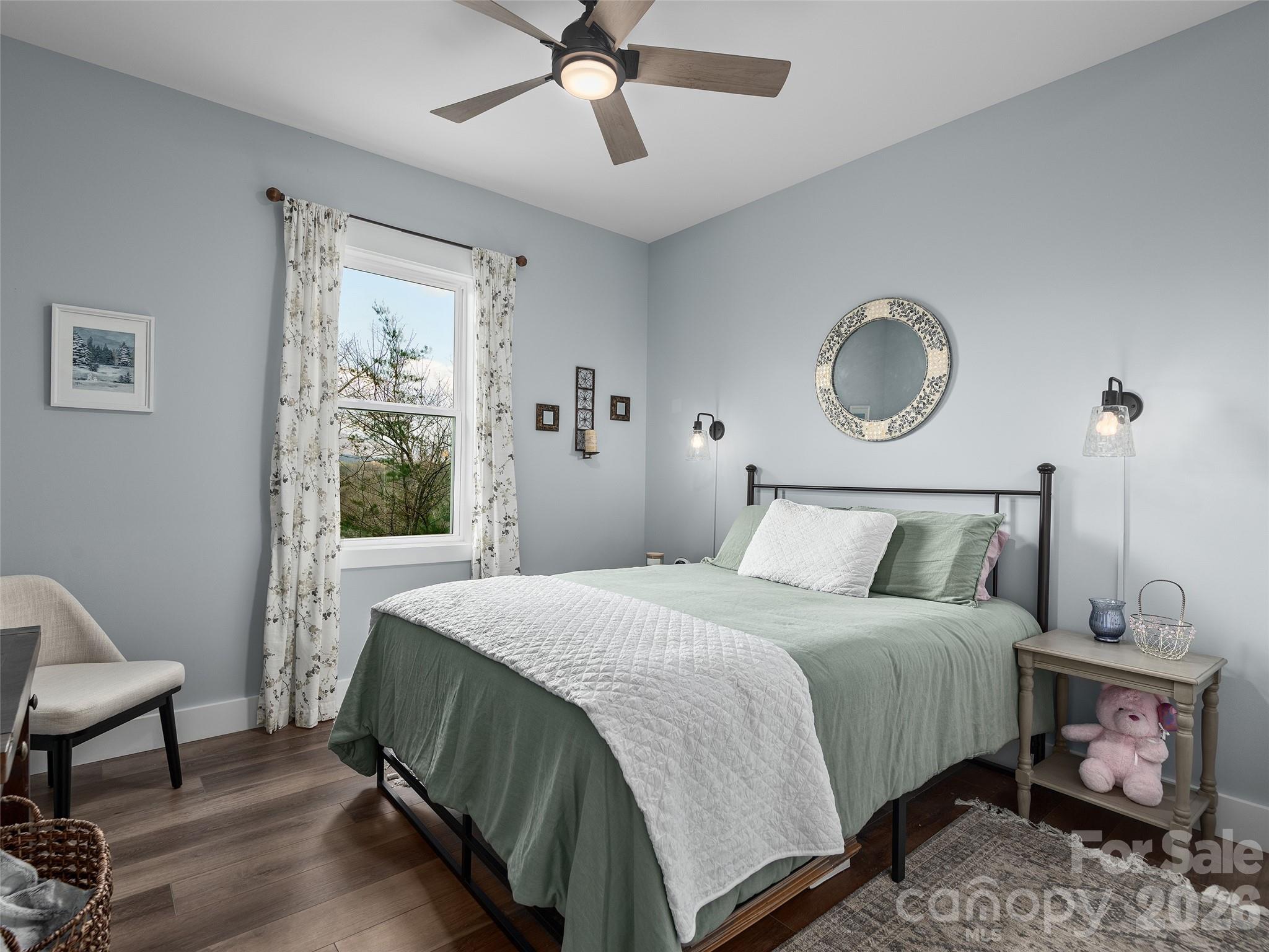 3244 Lake Adger Parkway Mill Spring, NC 28756 - Photo 25 of 44 a bedroom with a bed and window