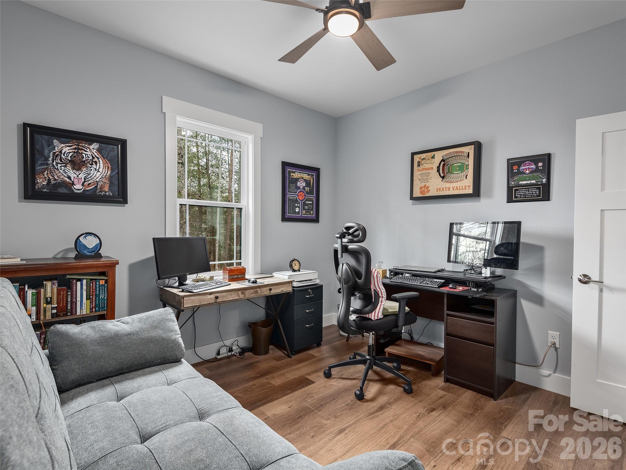 3244 Lake Adger Parkway Mill Spring, NC 28756 - Photo 30 of 44 a view of a livingroom with workspace and a couch