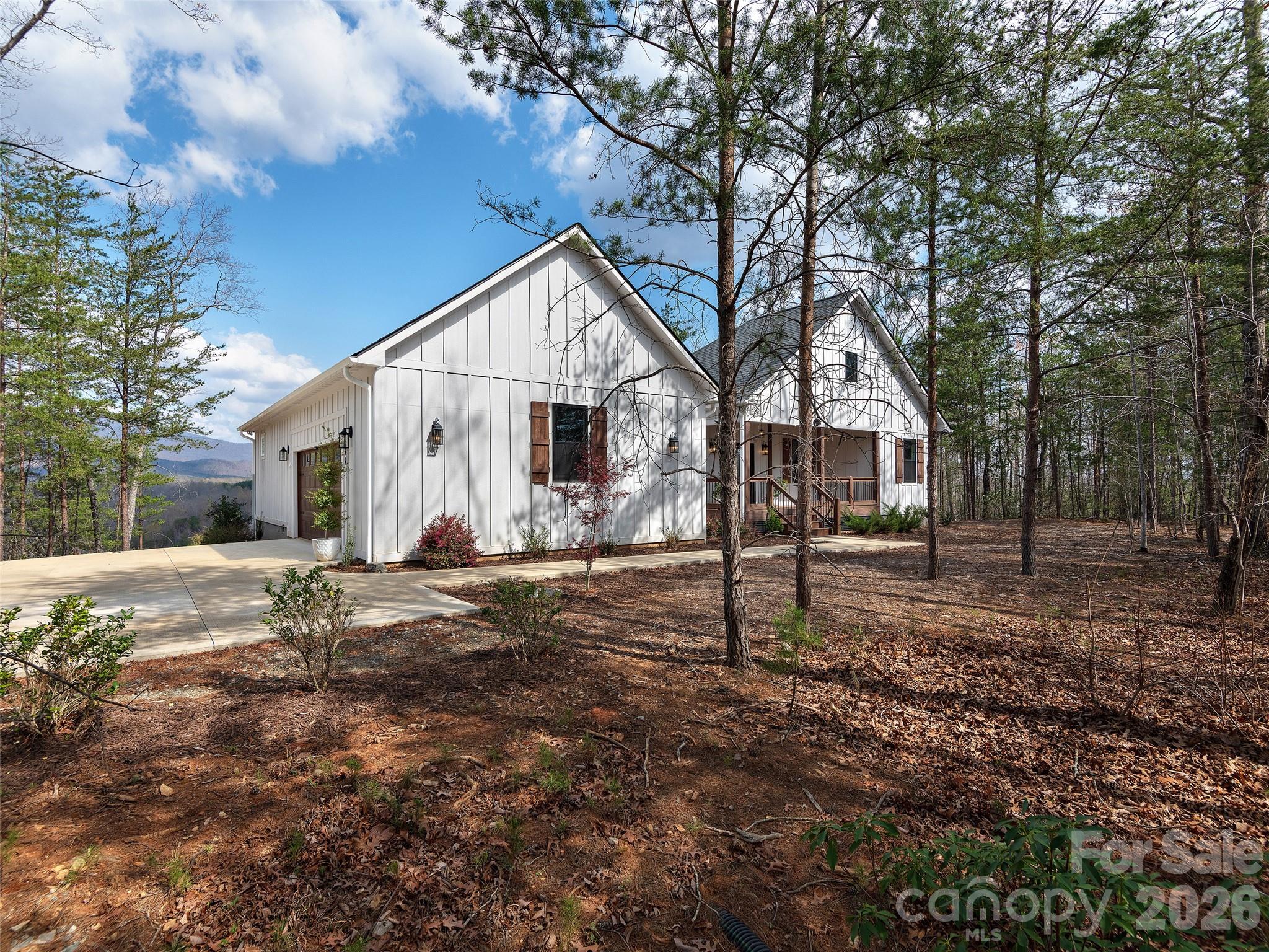 3244 Lake Adger Parkway Mill Spring, NC 28756 - Photo 37 of 44 a view of a house with a yard