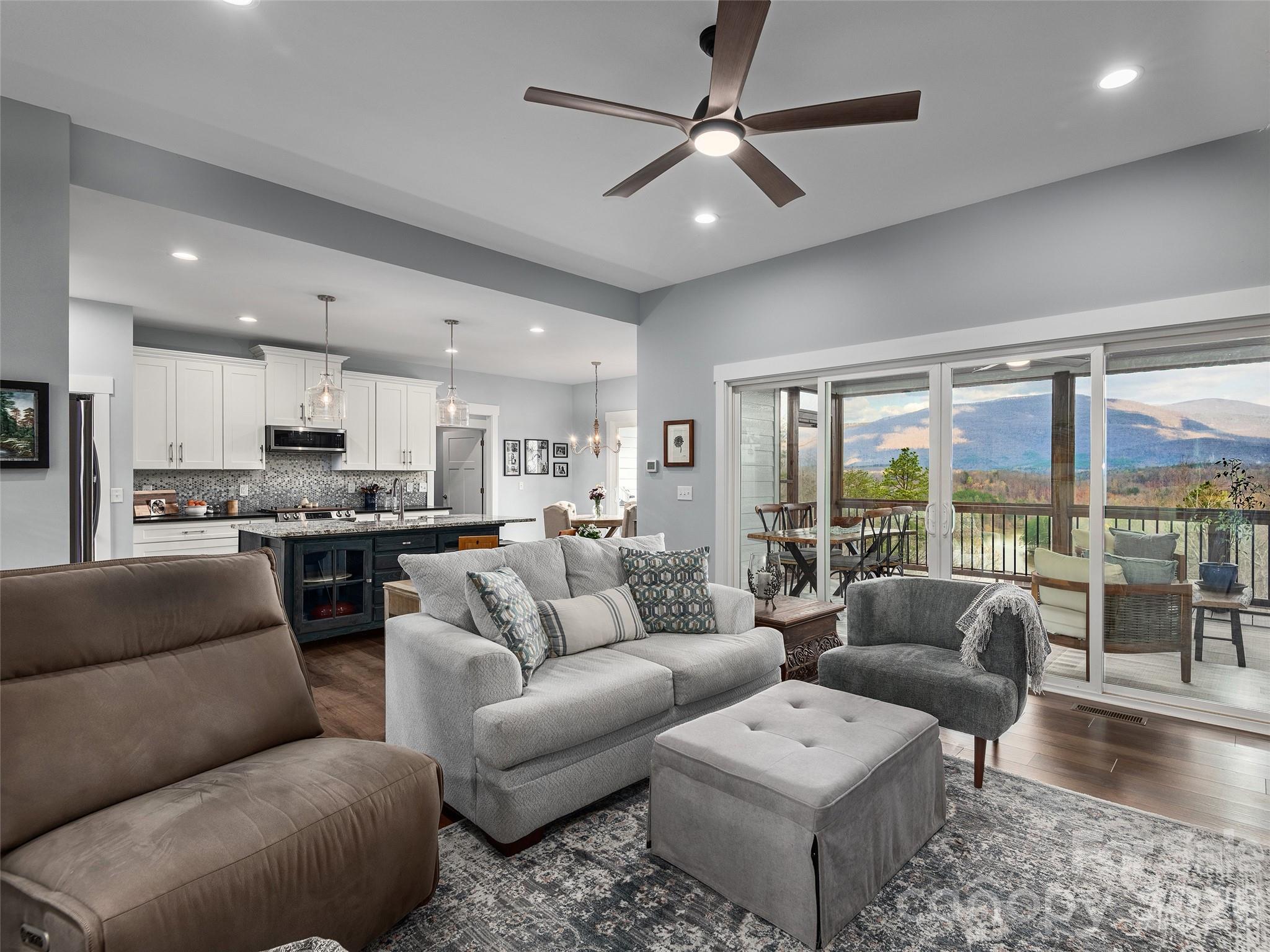 3244 Lake Adger Parkway Mill Spring, NC 28756 - Photo 6 of 44 a living room with furniture and a view of kitchen