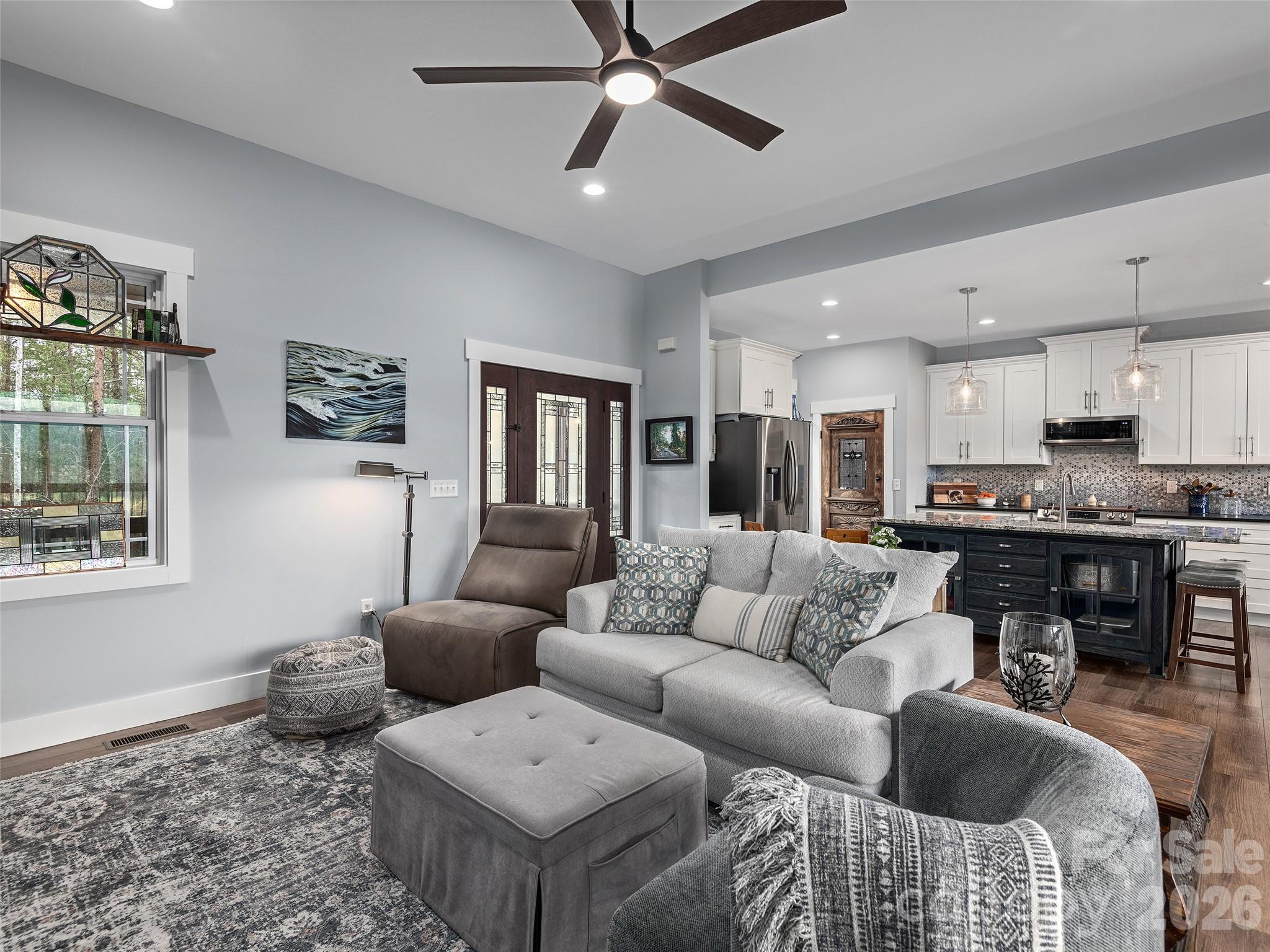 3244 Lake Adger Parkway Mill Spring, NC 28756 - Photo 7 of 44 a living room with furniture and kitchen view