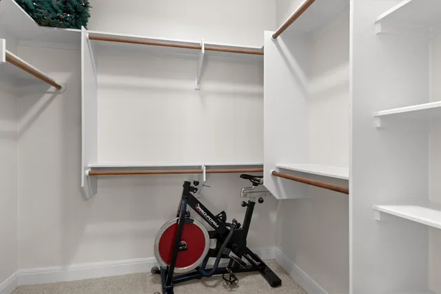 a view of an empty room with a ceiling fan