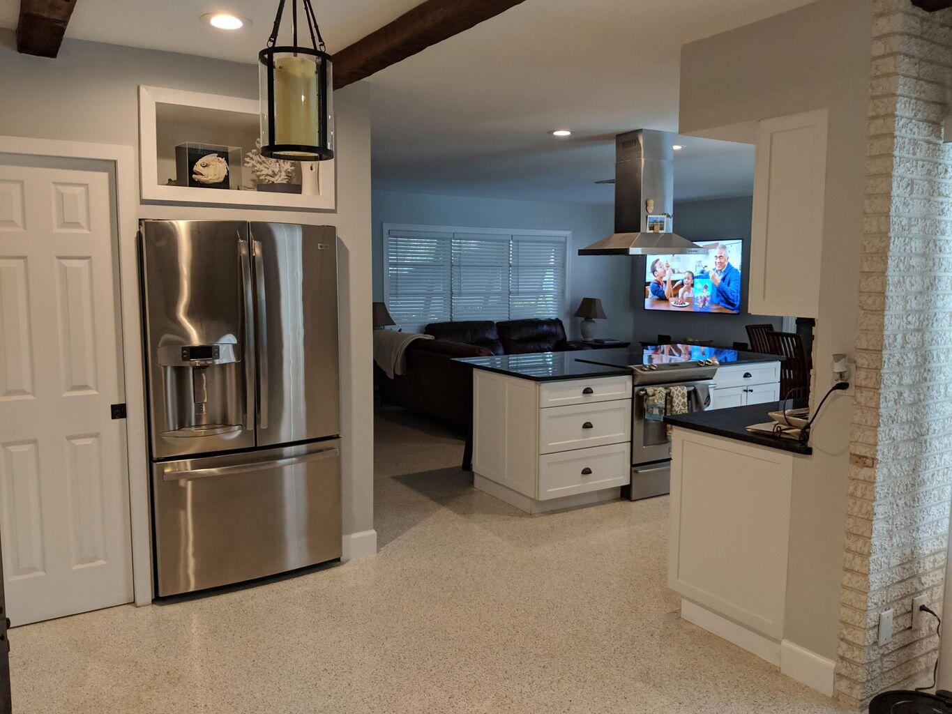 1012 Southwest 5th Street Boca Raton, FL 33486 - Photo 2 of 3 a kitchen with stainless steel appliances granite countertop a refrigerator and a stove